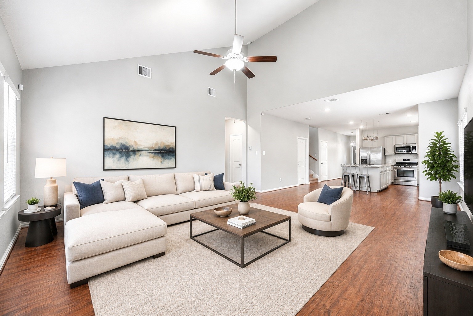 Looking back across the sweeping family room emphasizes the grand scale of the main living area, perfectly tailored for hosting gatherings or enjoying quiet evenings in a highly usable, airy environment. Virtually staged.