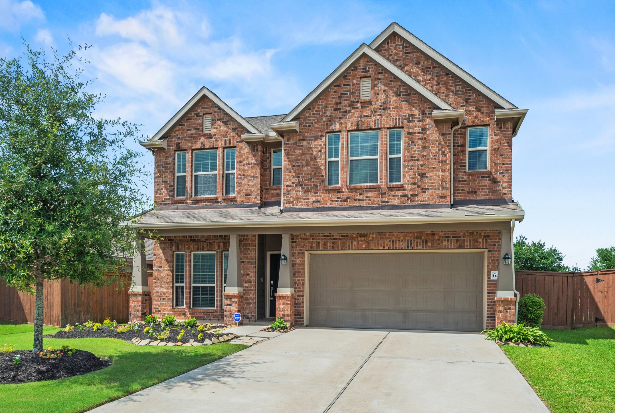 Welcome to 6418 Shadowbrook Hollow Trail, a beautiful home by Lennar, beautifully situated on a cul-de-sac within the community of Elyson. Boasting a striking brick and stone facade, this home offers immediate access to a highly desirable, active, and friendly neighborhood environment.