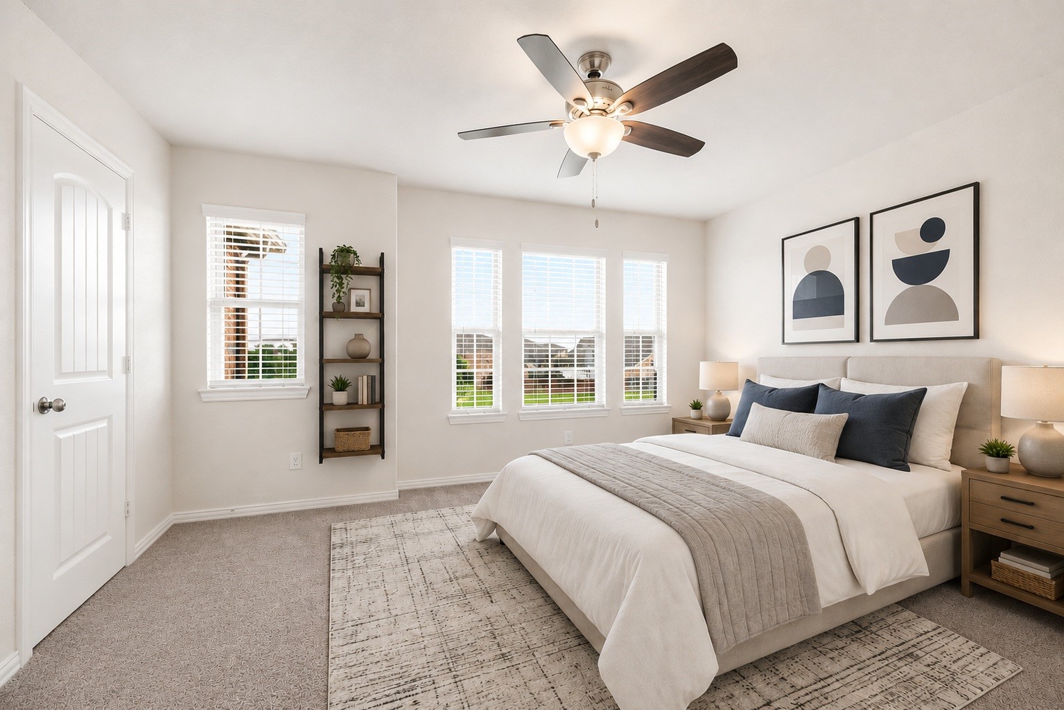 Offering great versatility for family or guests, this bright auxiliary bedroom features soft wall paint, a modern wood-blade ceiling fan, and a wide window alcove overlooking the property. Virtually staged.