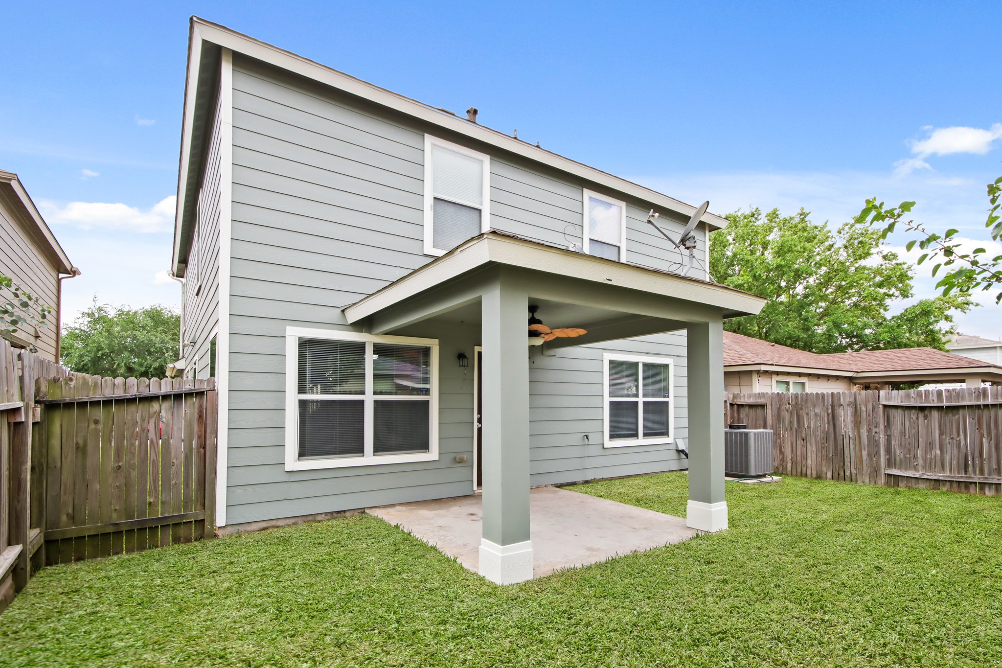 The backyard features a solid board fence for more privacy.