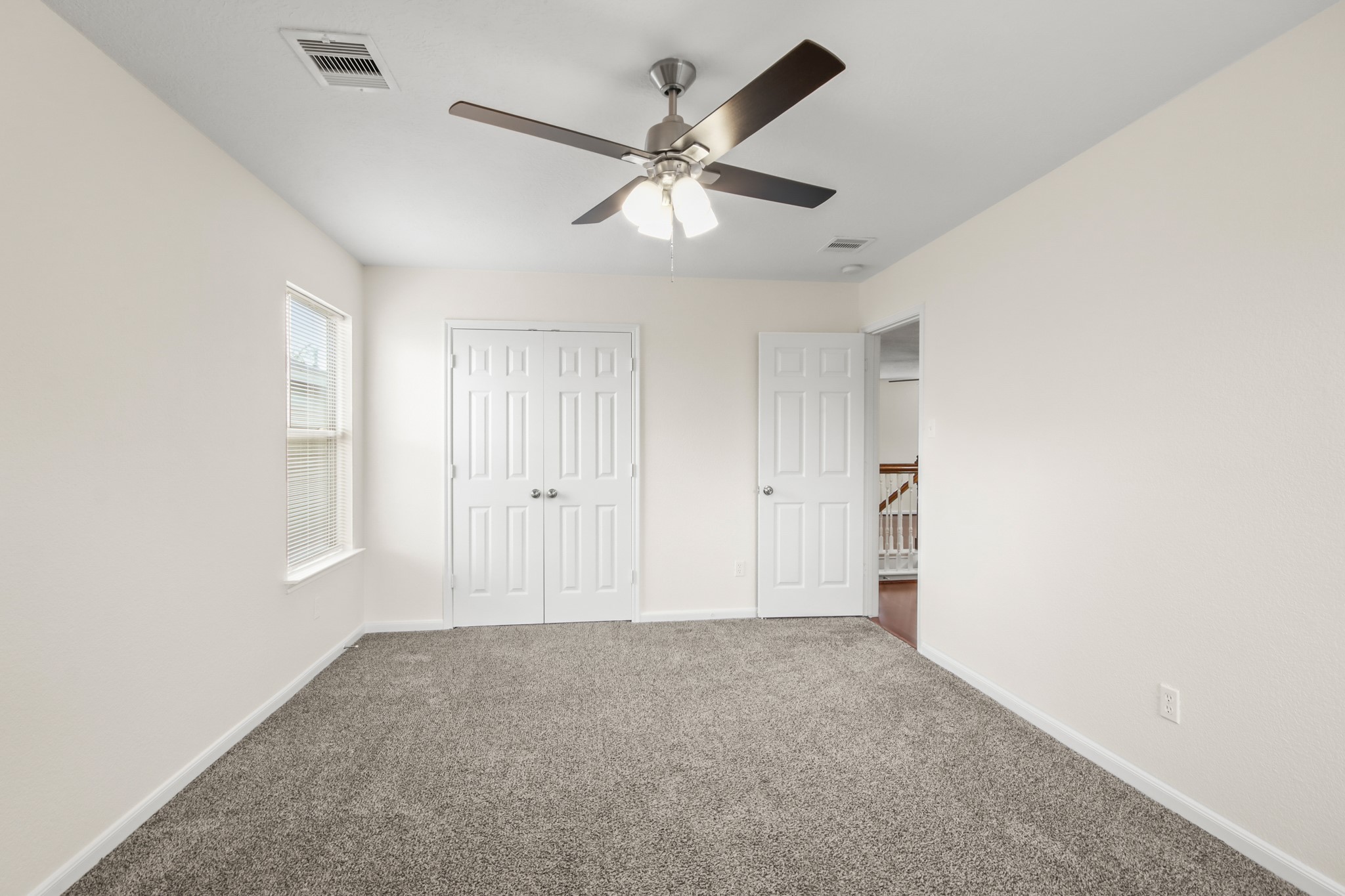 The space includes a double-door closet, offering both functionality and everyday convenience.
