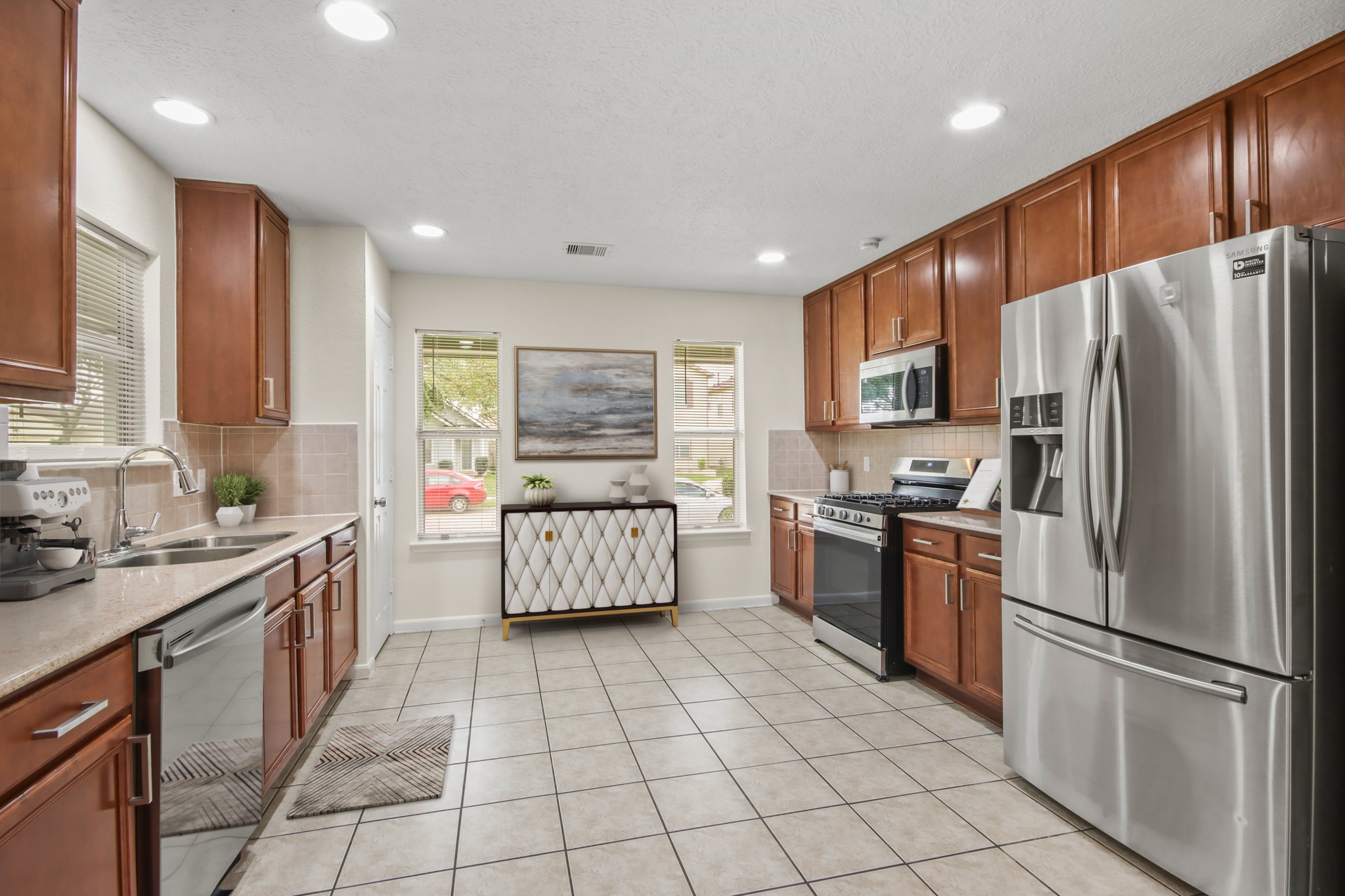 Virtually Staged: Beautiful kitchen with granite countertops, open space, steel stainless appliances, recessed lighting, and plenty of wooden cabinetry for storage. It includes a pantry as well. Virtually Staged: Beautiful kitchen with granite countertops, open space, steel stainless appliances, recessed lighting, and plenty of wooden cabinetry for storage. It includes a pantry as well.