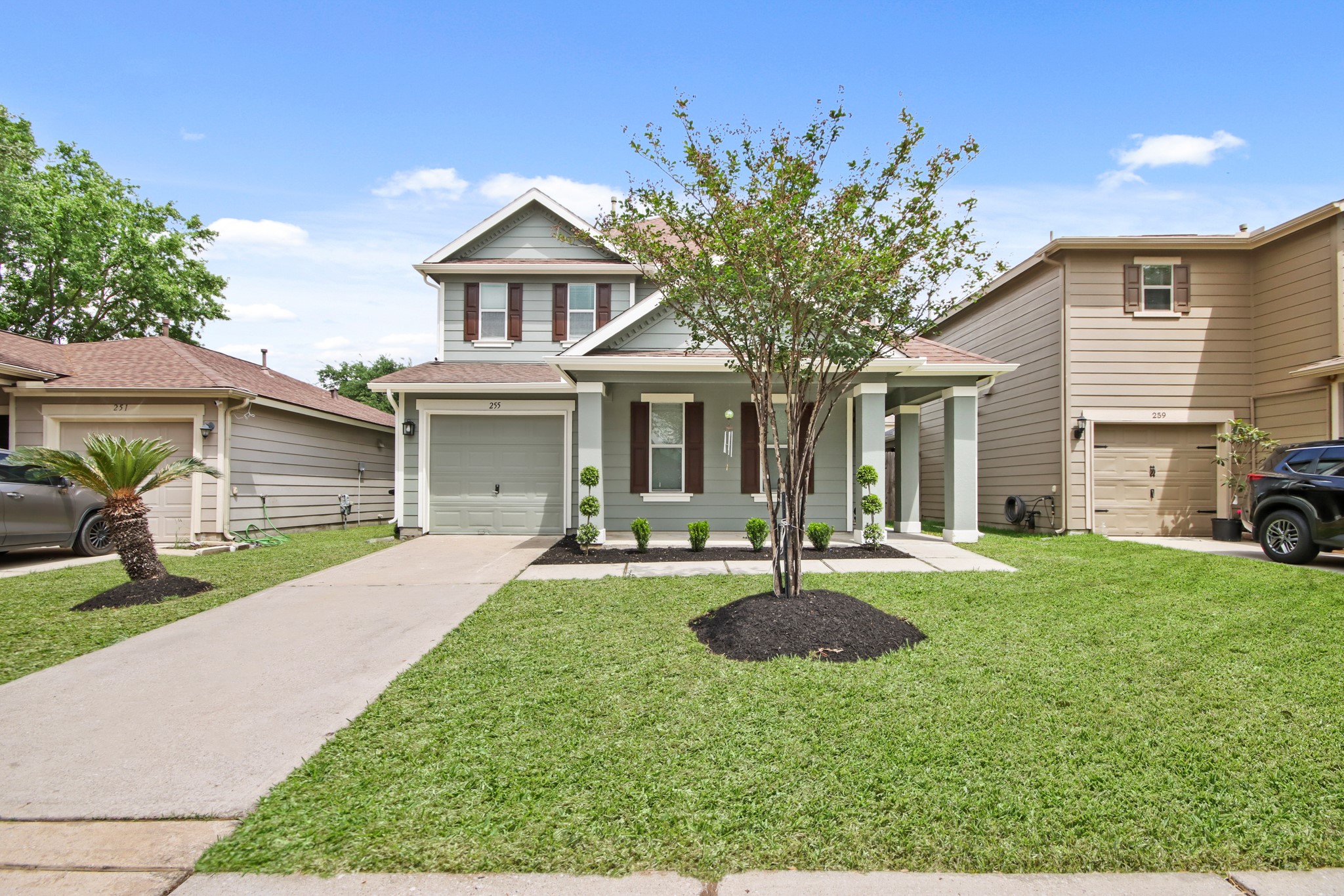 The home features a single-car garage, with a long driveway. The home features a single-car garage, with a long driveway.