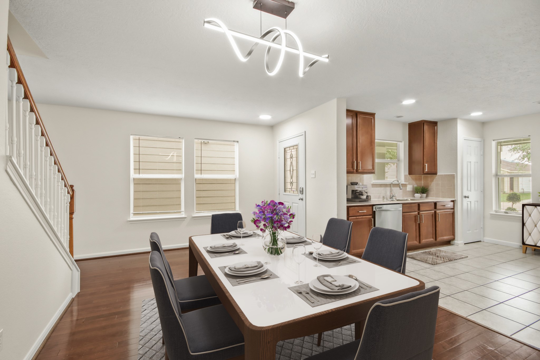 Virtually Staged: Beautiful dining area featuring a unique pendant lighting, wood floors, direct access to the kitchen perfect for entertaining. Virtually Staged: Beautiful dining area featuring a unique pendant lighting, wood floors, direct access to the kitchen perfect for entertaining.