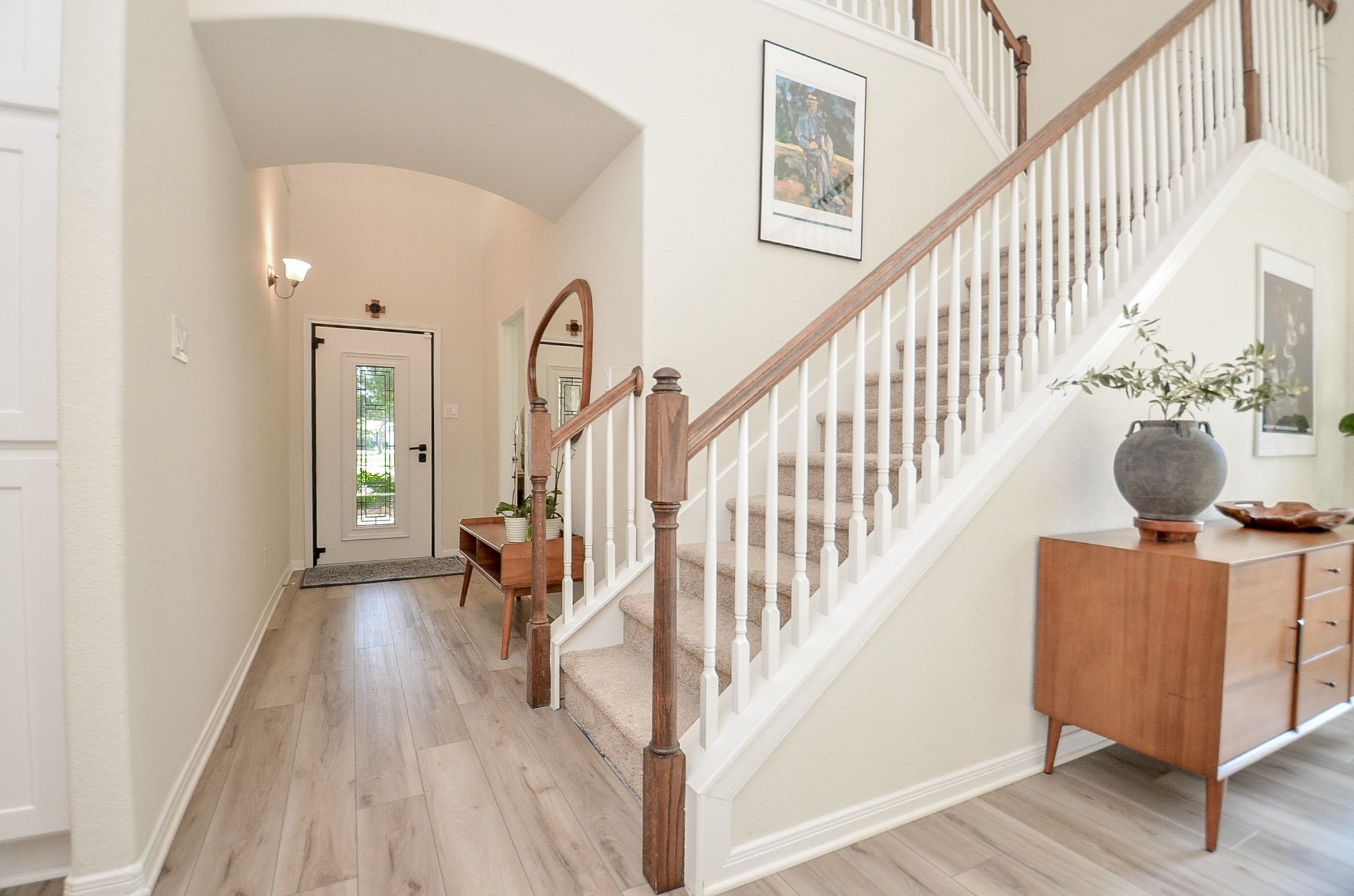 View of staircase and spacious entry showcasing the home's open design.