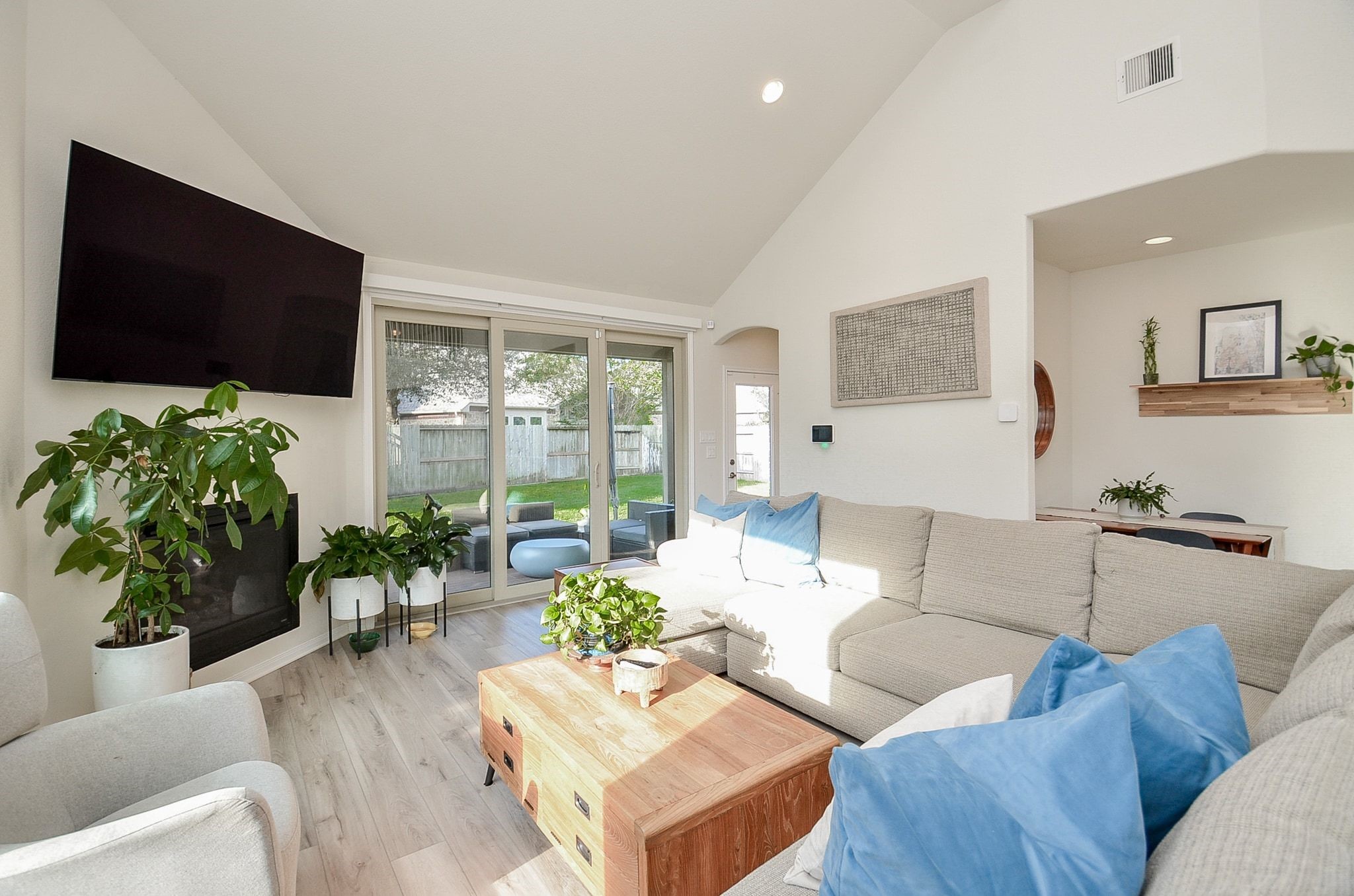 Inviting living room with cozy fireplace and sliding doors to the covered patio.