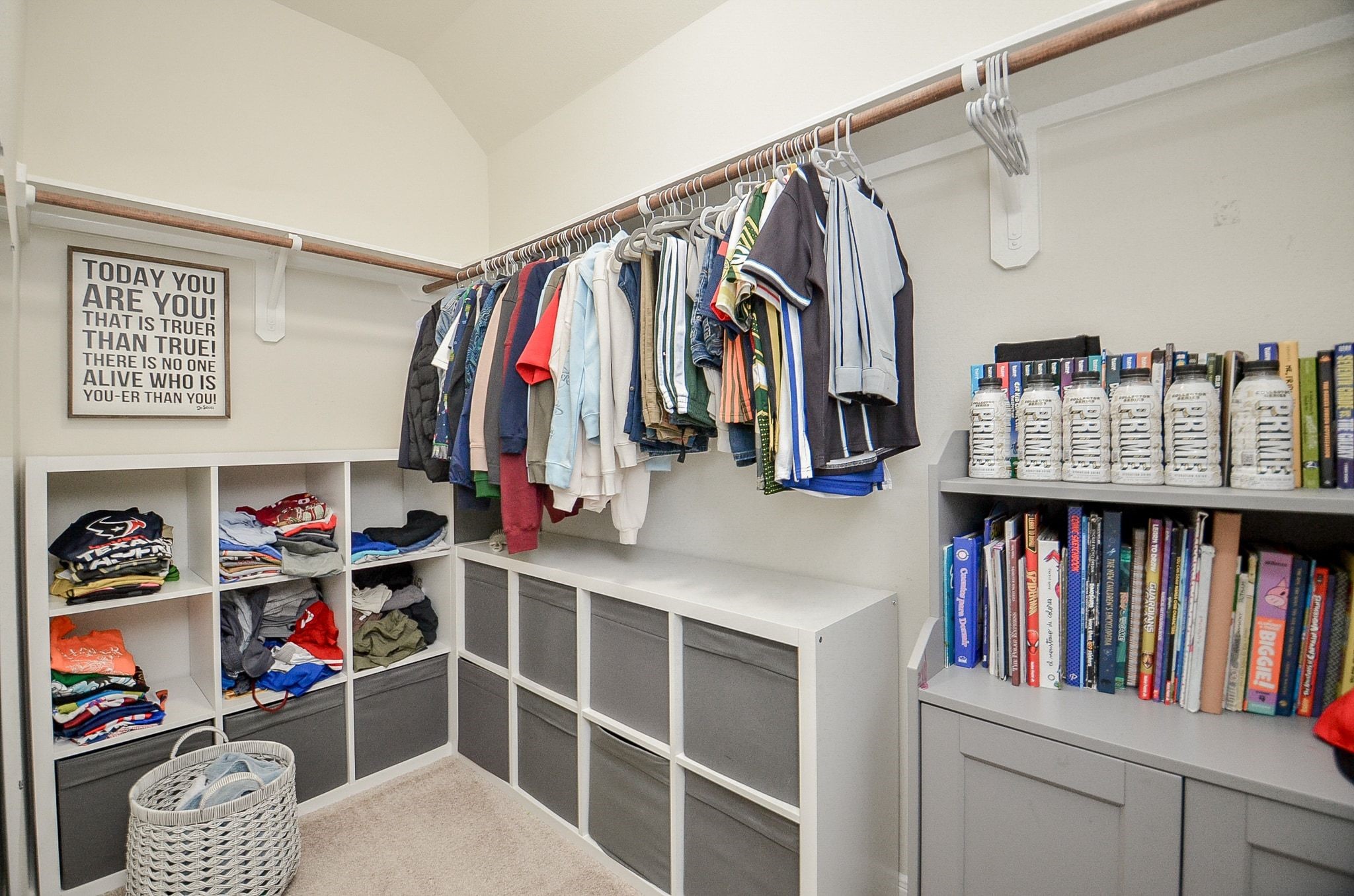 Generous walk-in closet with plenty of shelving and hanging space.