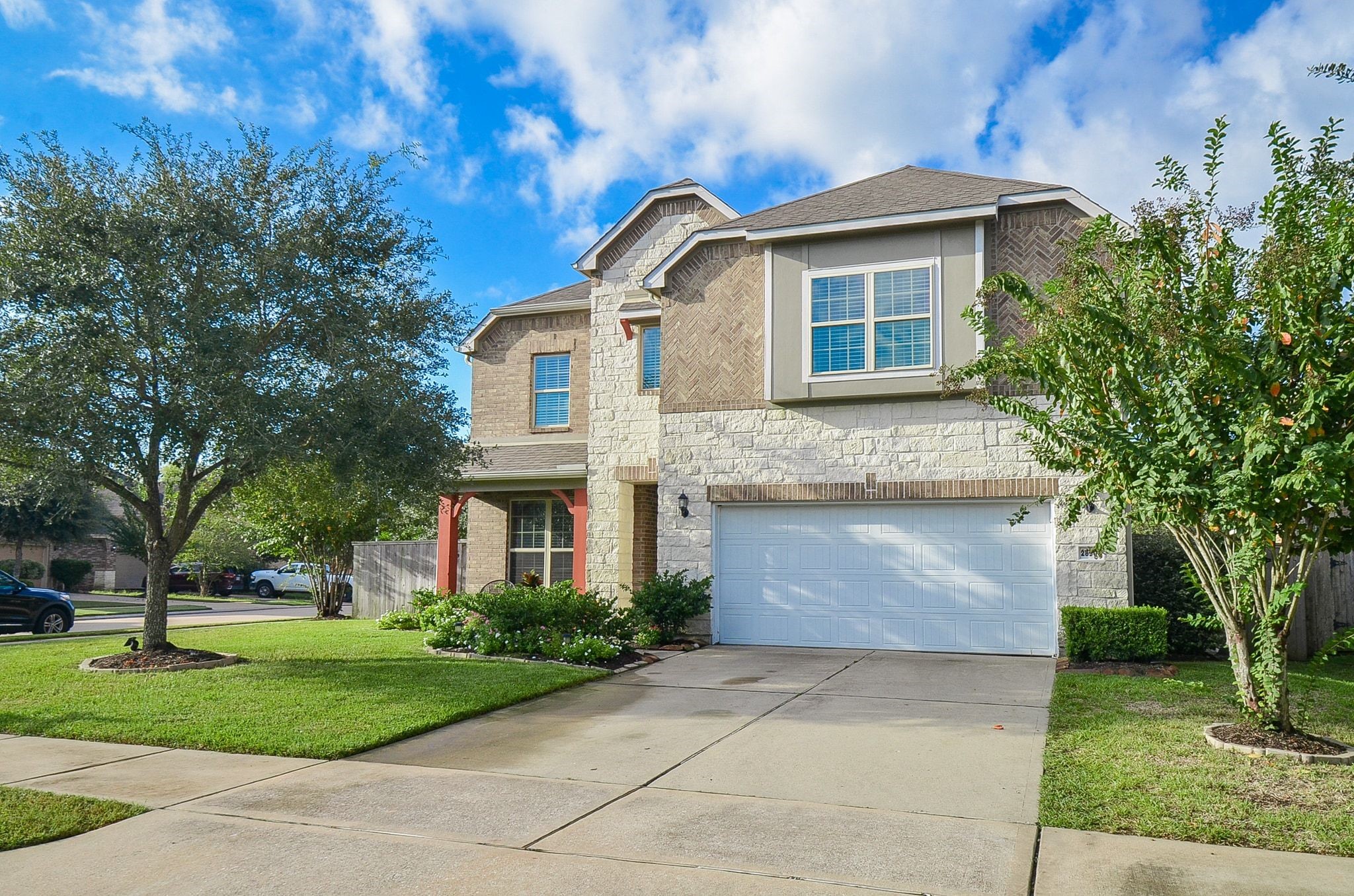 Beautiful landscaping and a charming front covered porch. Beautiful landscaping and a charming front covered porch.