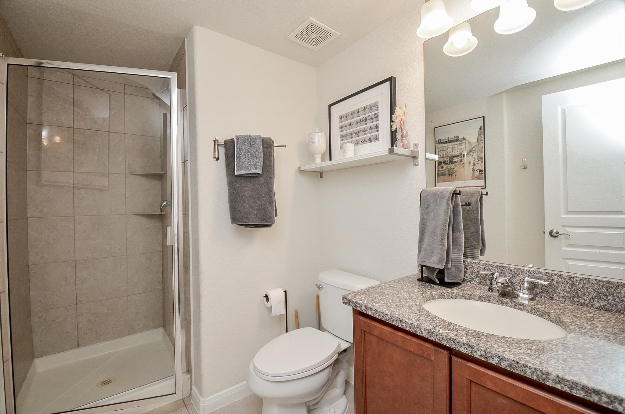 Convenient private ensuite bathroom featuring a walk-in shower.