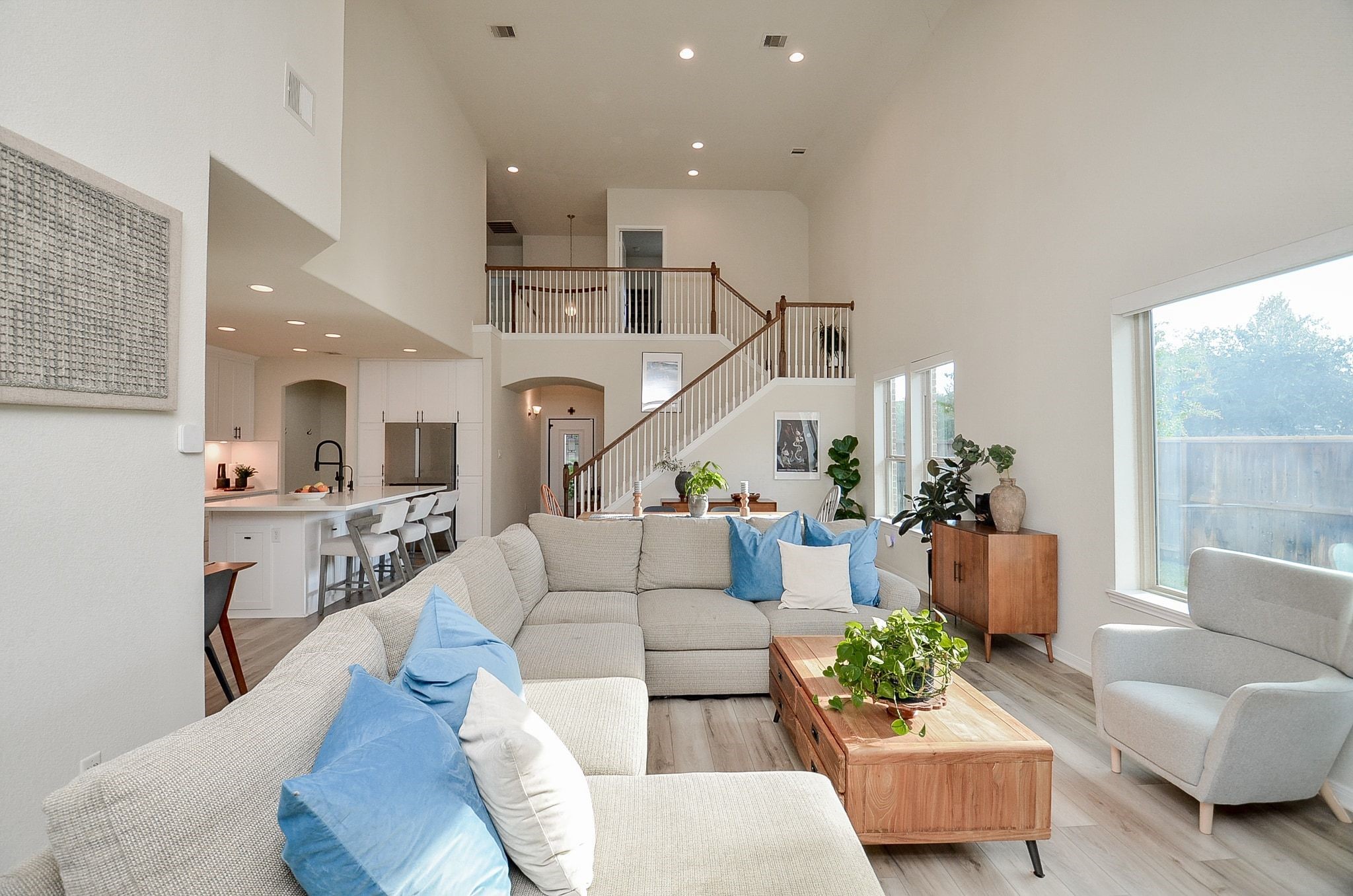Seamless flow between the living room, dining area, and beautifully renovated kitchen.