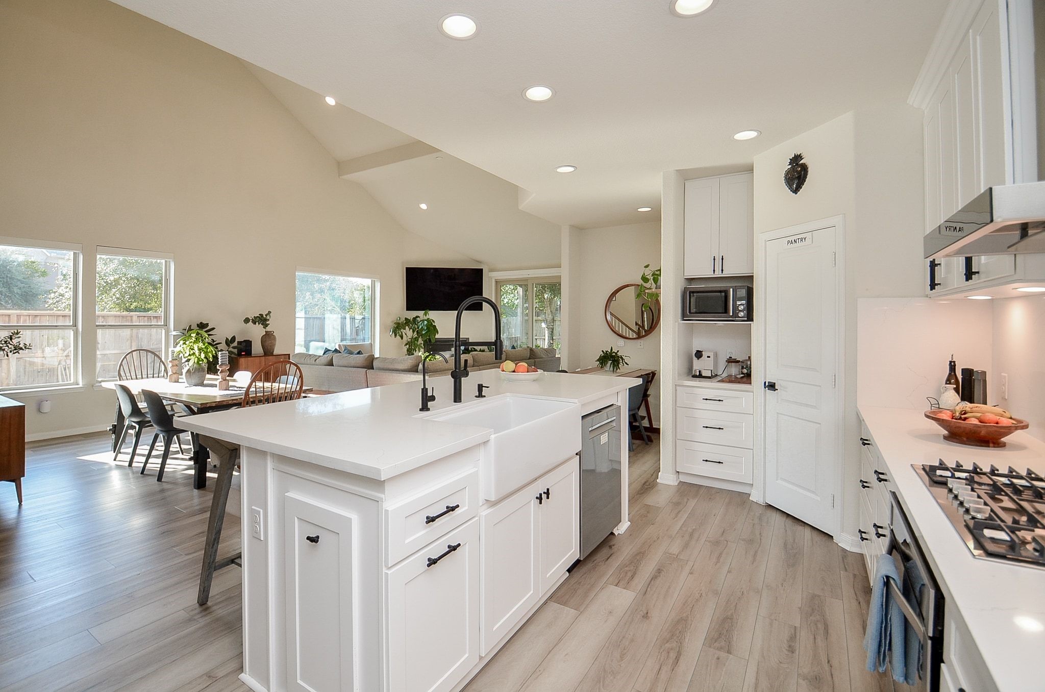 Beautifully renovated kitchen opens to the dining and living areas.