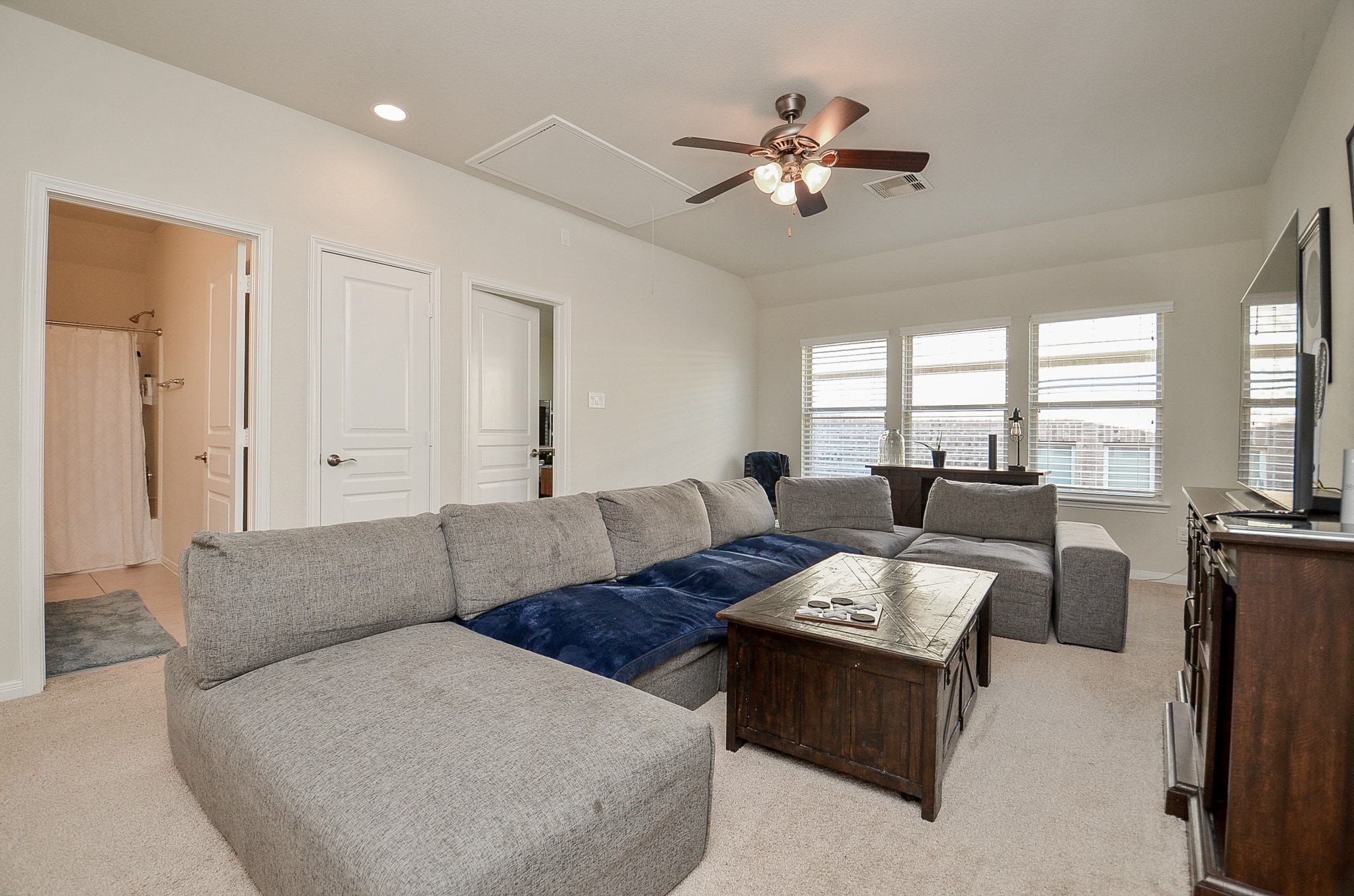 Spacious upstairs game room, perfect for movie nights and entertaining.