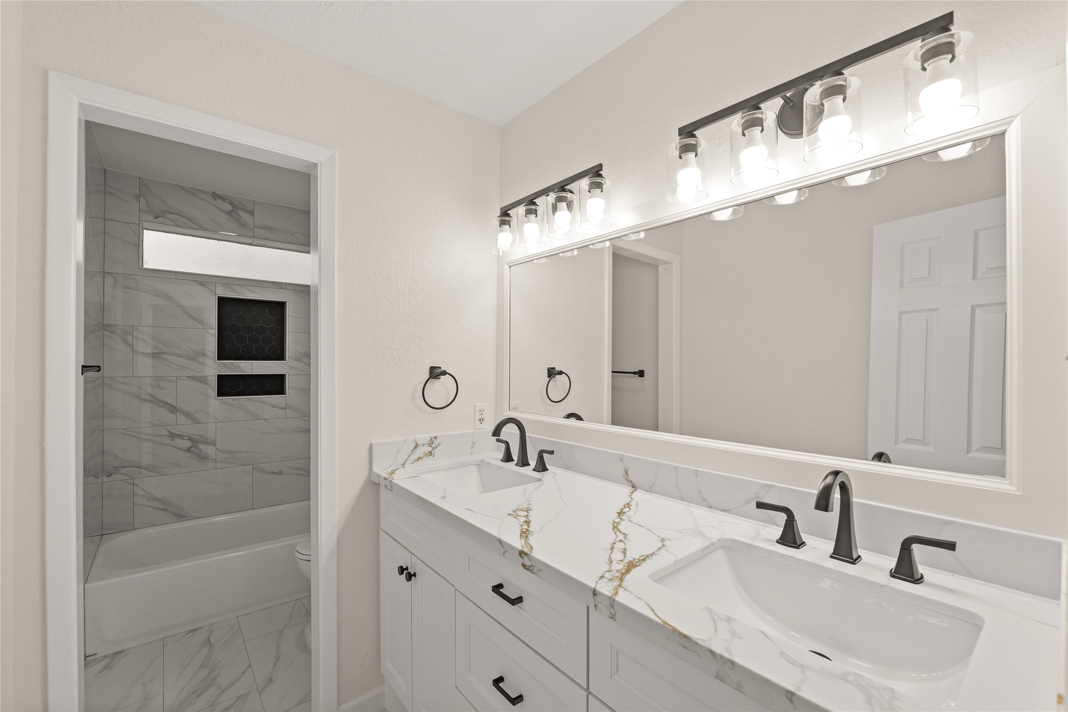 Secondary bathroom with dual sinks