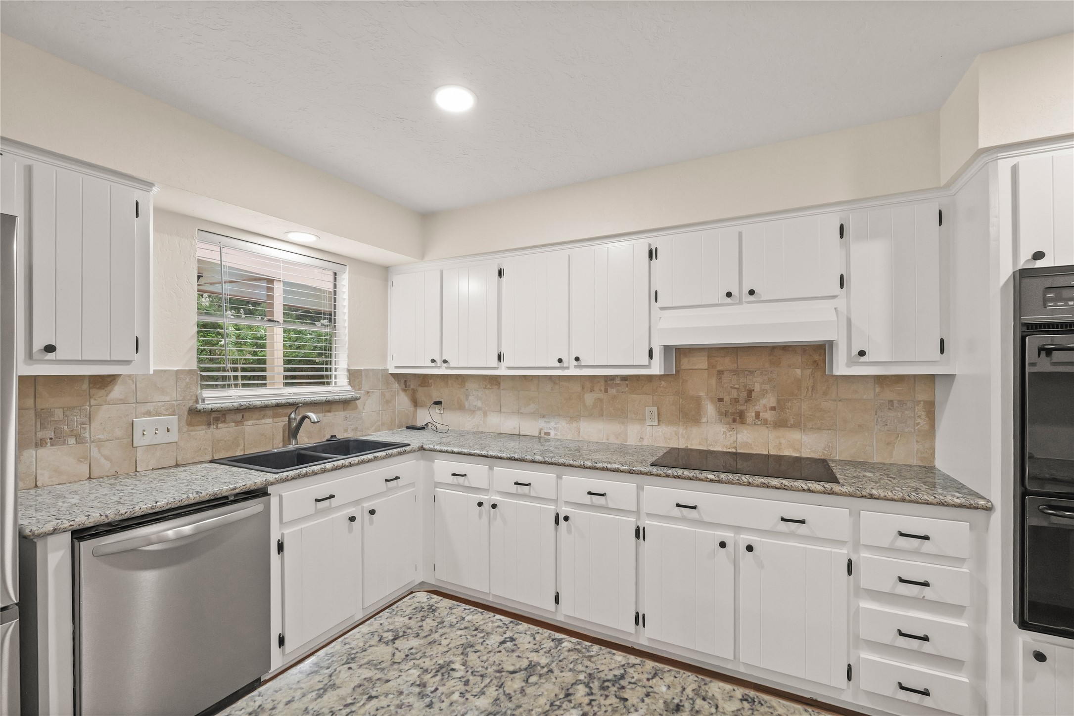 Updated kitchen with ample counterspace and cabinets