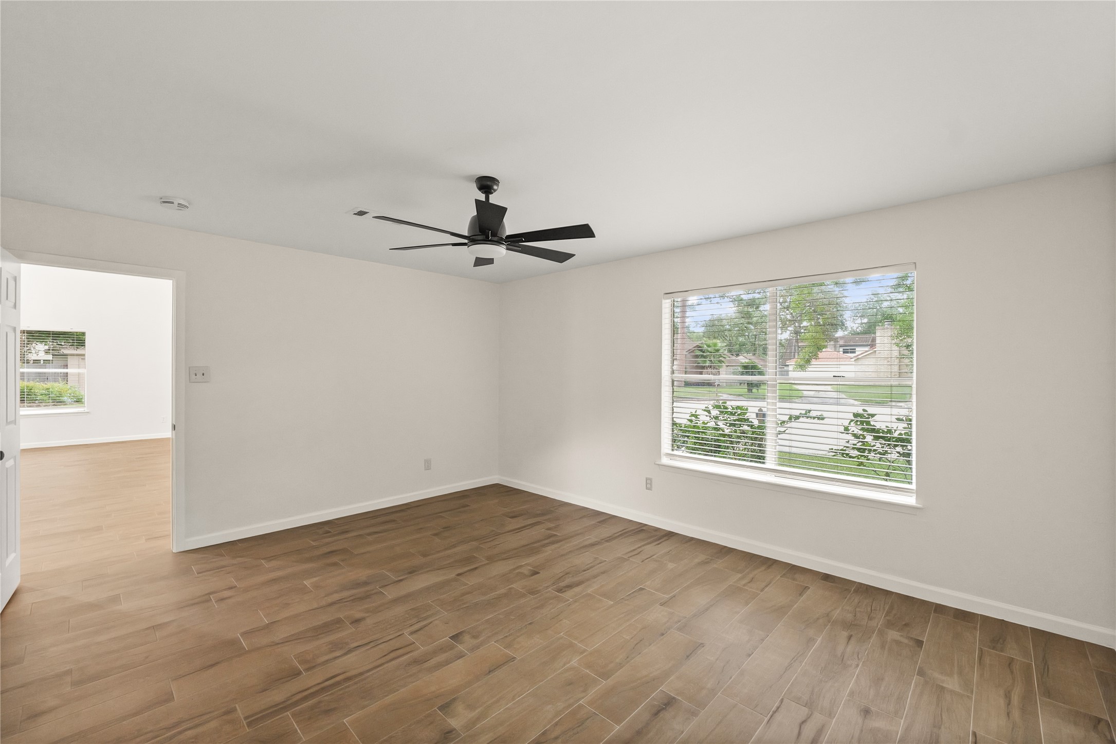 Corner view of primary bedroom
