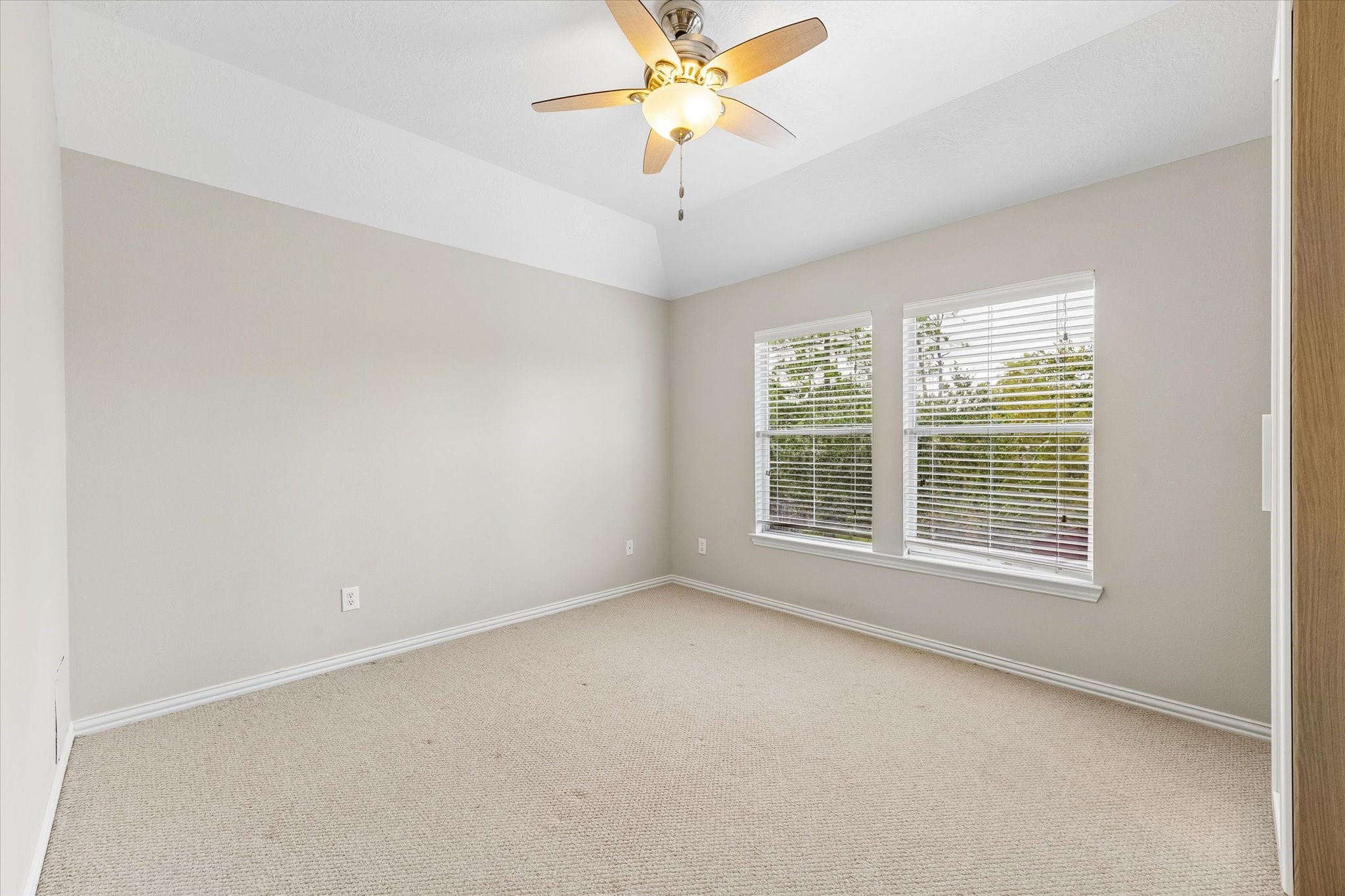 Second of three secondary bedrooms upstairs. All bedrooms have ceiling fans. This bedroom has an unobstructed view of the poool