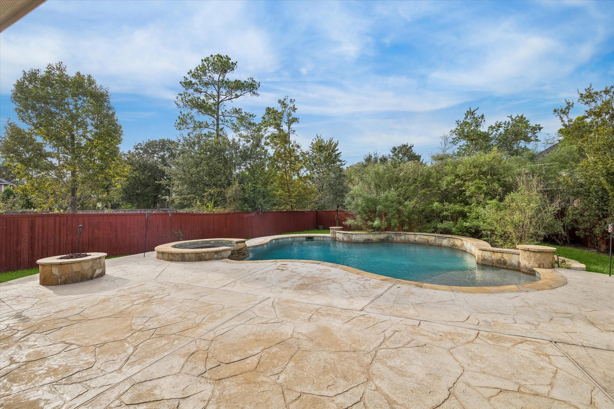 Gather around the firepit and enjoy the resort style pool. Notice how much privacy this lot offers
