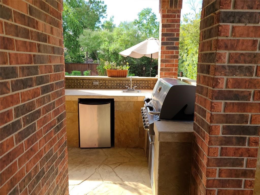 Outdoor kitchen under covered patio