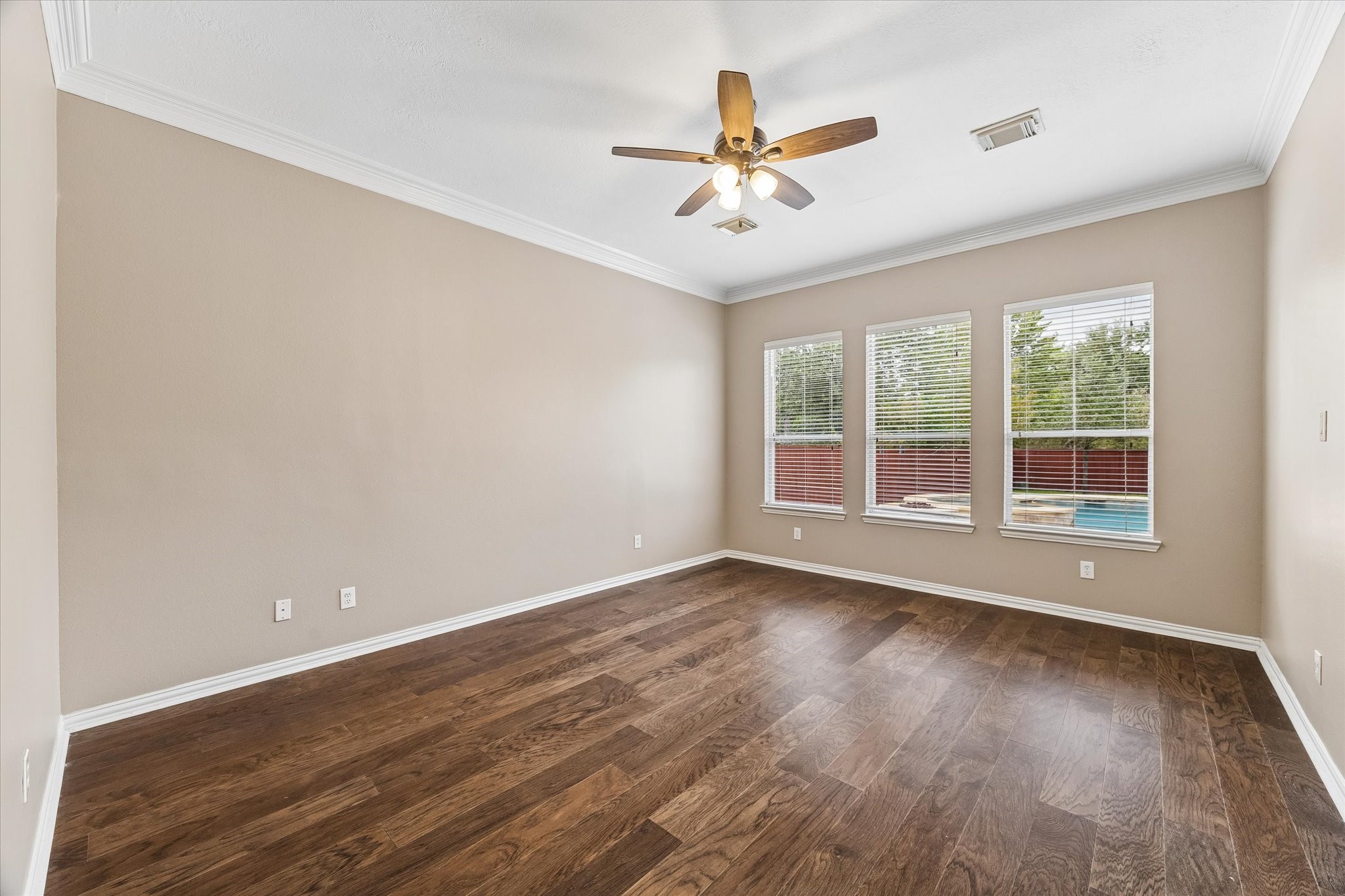 No carpet  throughout the first floor. Primary bedroom offers unobstructed view of the outdoor firelog and pool. Total privacy in the back.