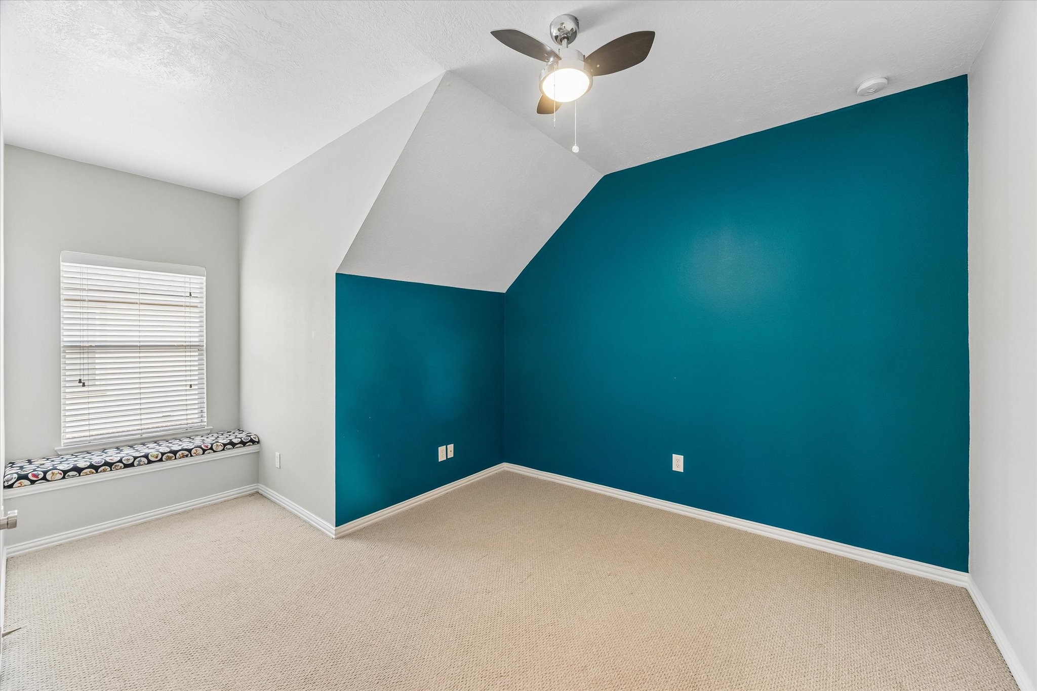 First of three secondary bedrooms upstairs. All bedrooms have ceiling fans.
