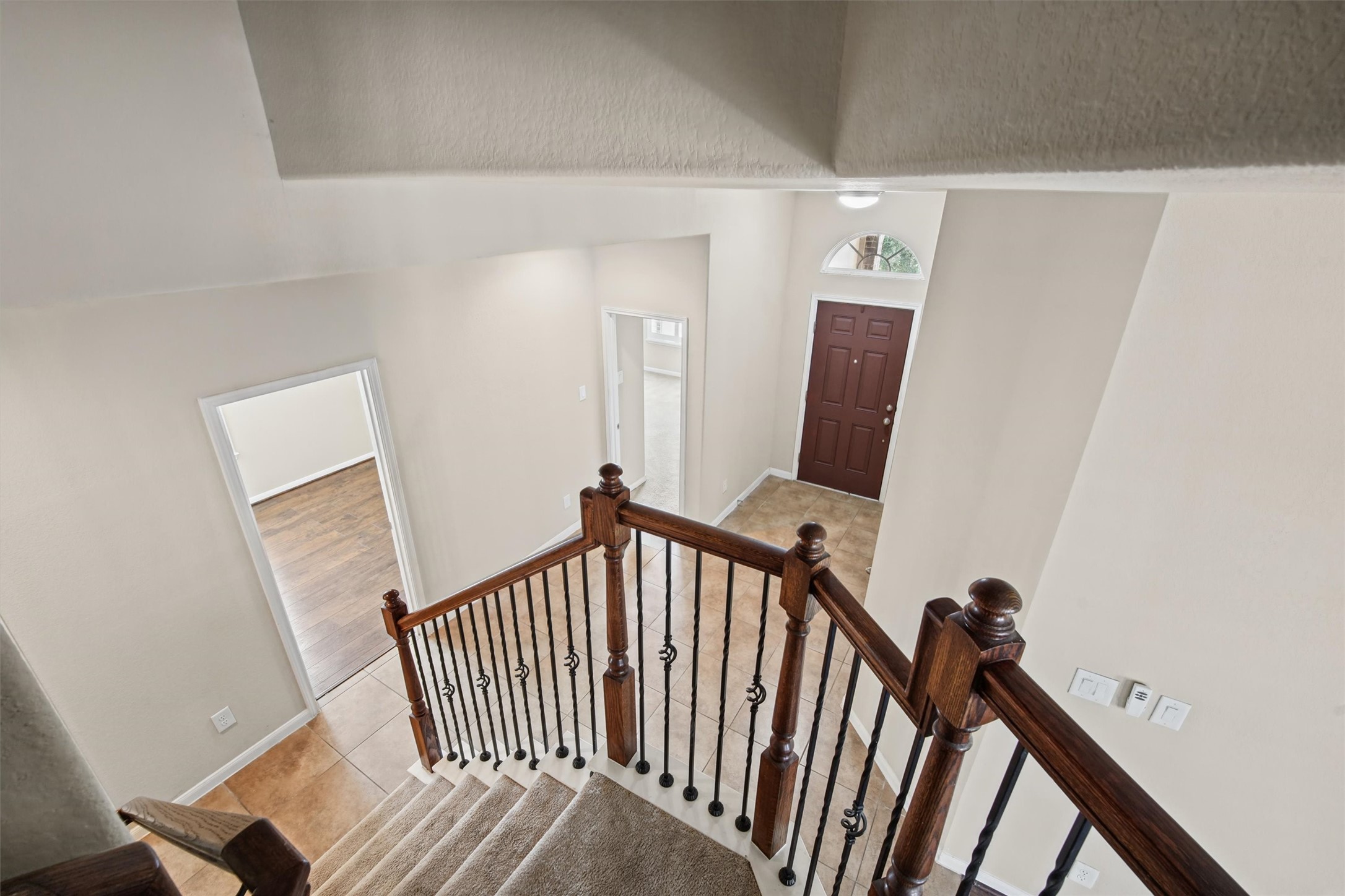 Winding staircase and high ceilings lead to an enormous flex space!