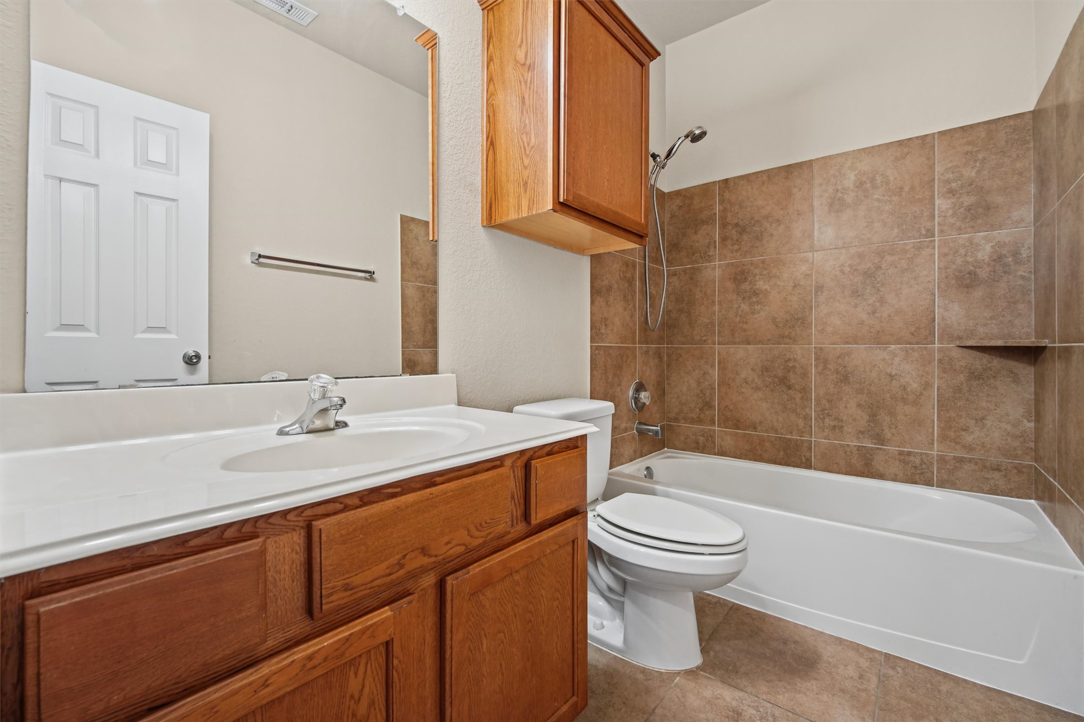 Full bath conveniently located in nook accommodating all secondary bedrooms- all conveniently located downstairs!