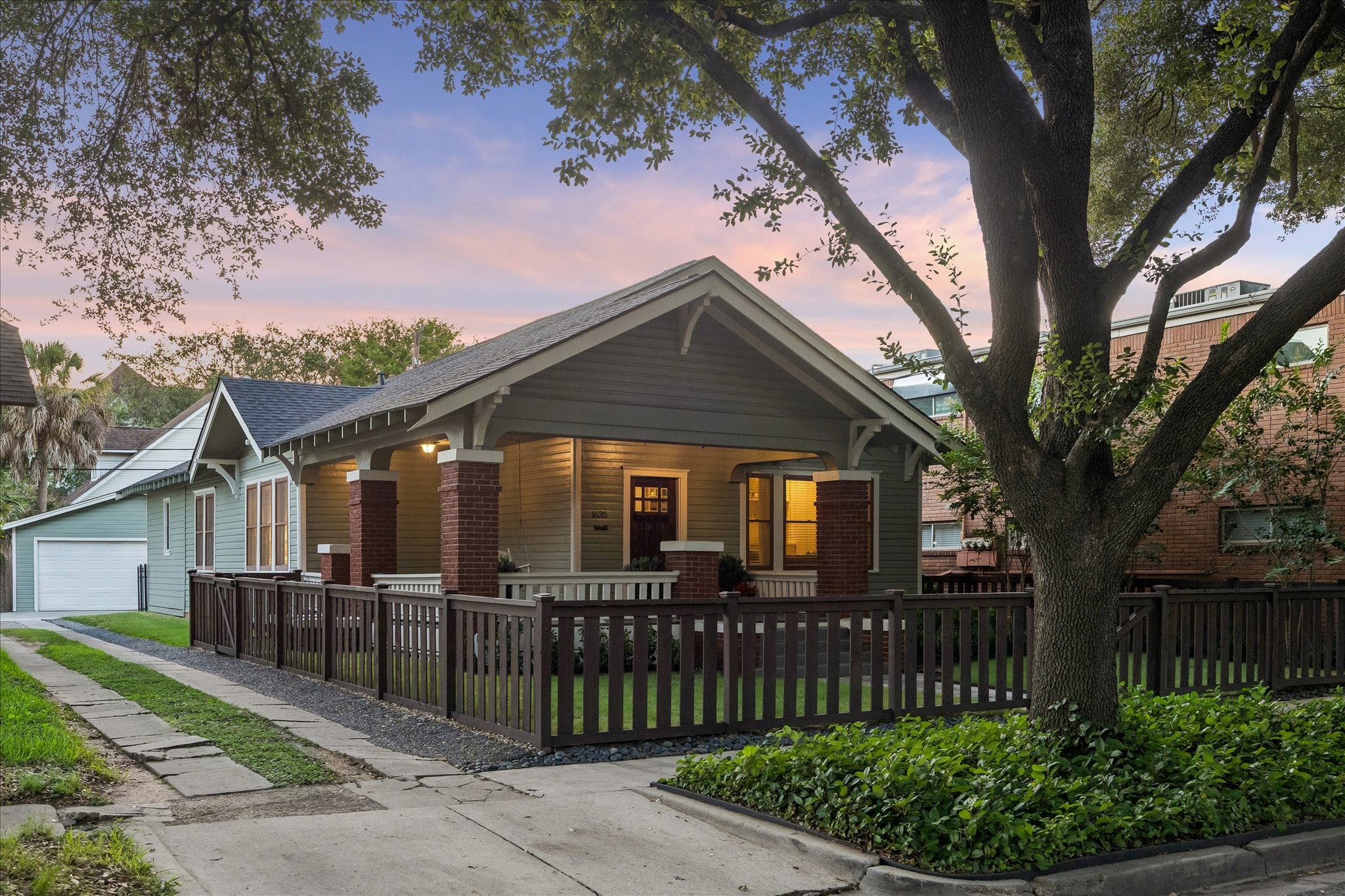 This amazing 1920s bungalow features mature trees and a fully fenced front yard with main gate facing the street and side gate accessing the driveway. This amazing 1920s bungalow features mature trees and a fully fenced front yard with main gate facing the street and side gate accessing the driveway.