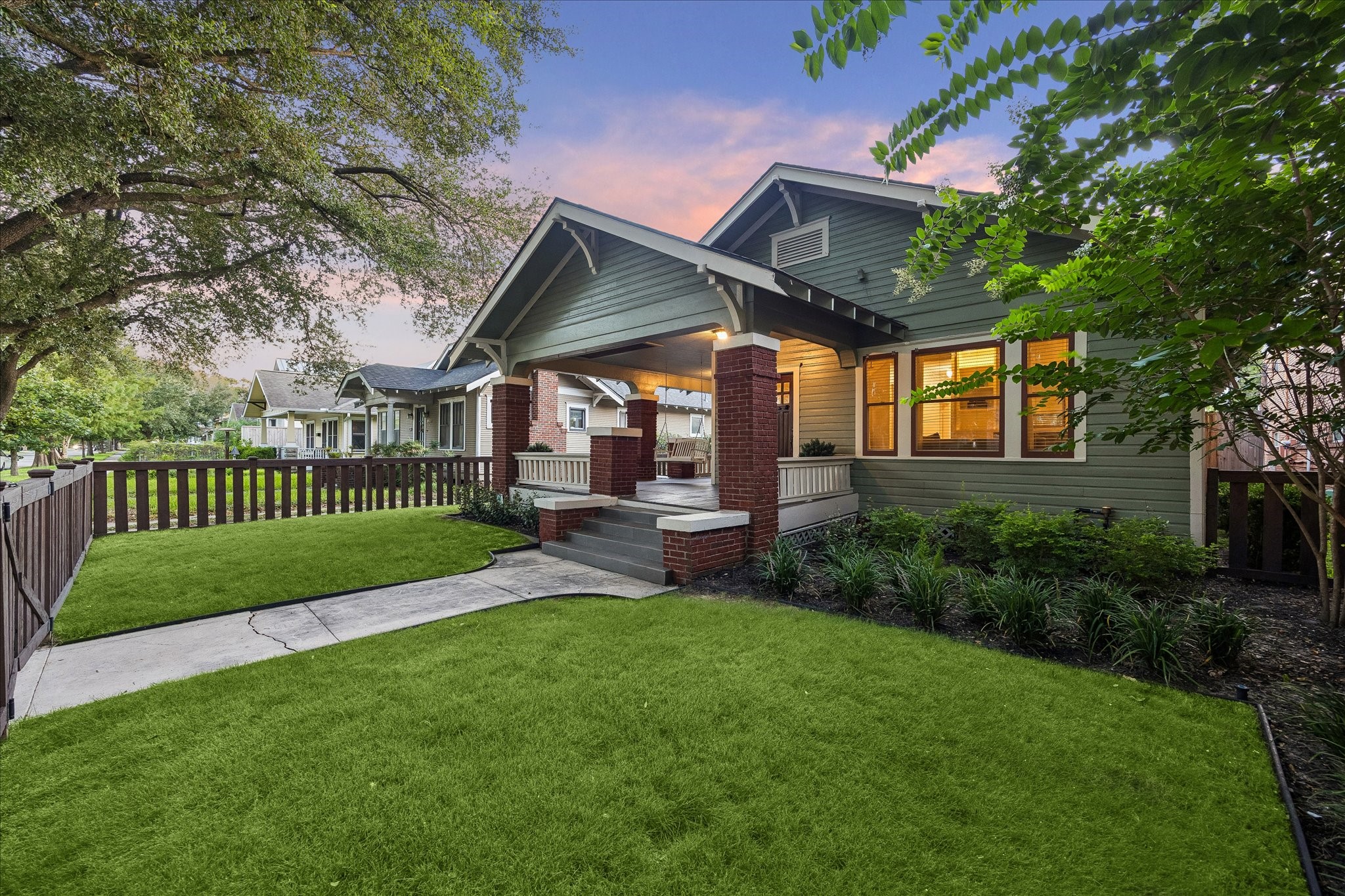 Beautiful landscaping, lush grass, and a quiet street makes it difficult to decide if you will spend your evenings on the front or back porch! Beautiful landscaping, lush grass, and a quiet street makes it difficult to decide if you will spend your evenings on the front or back porch!