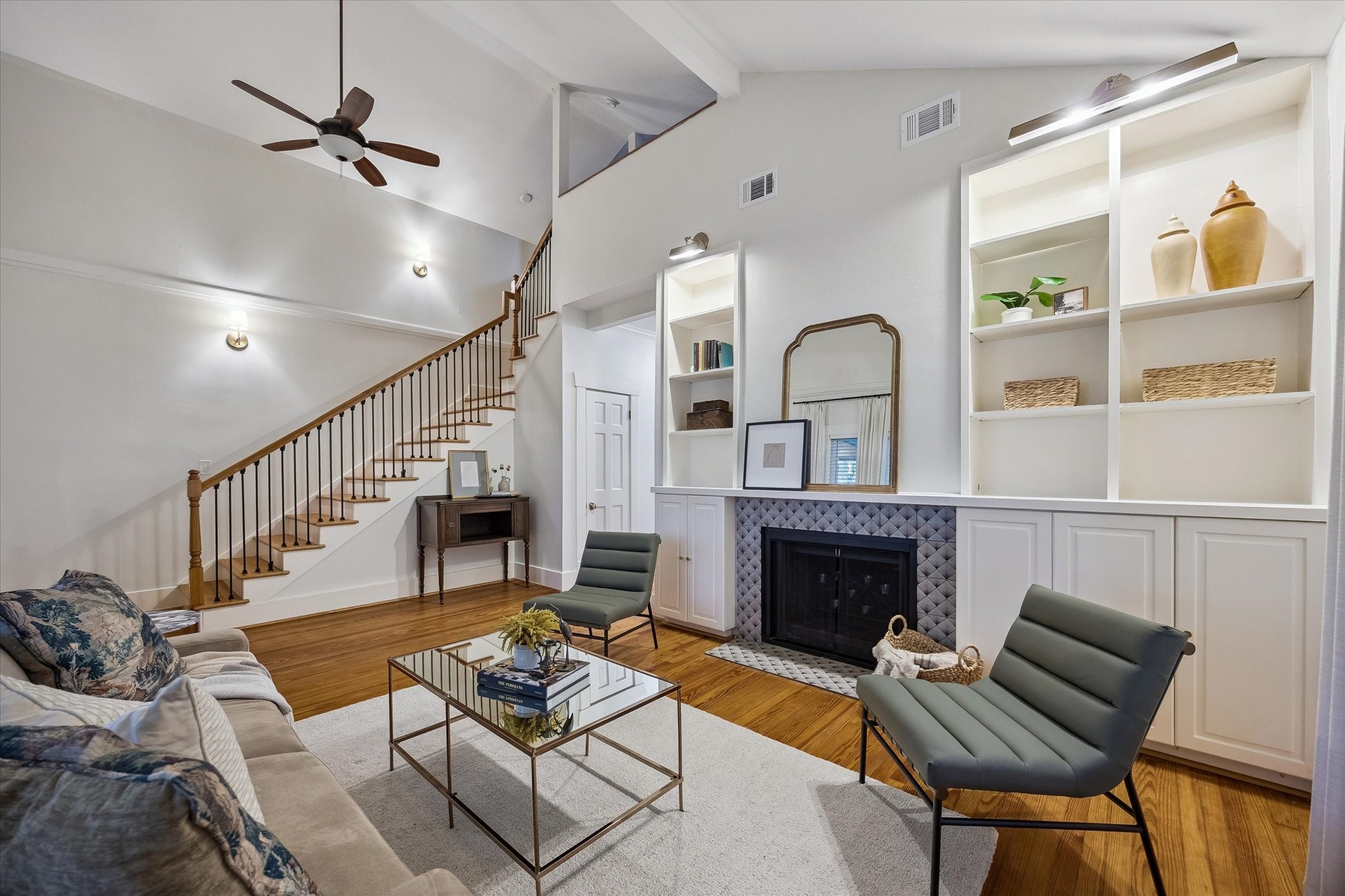 Beautiful living room featuring high ceilings; fireplace; and built-ins. Beautiful living room featuring high ceilings; fireplace; and built-ins.