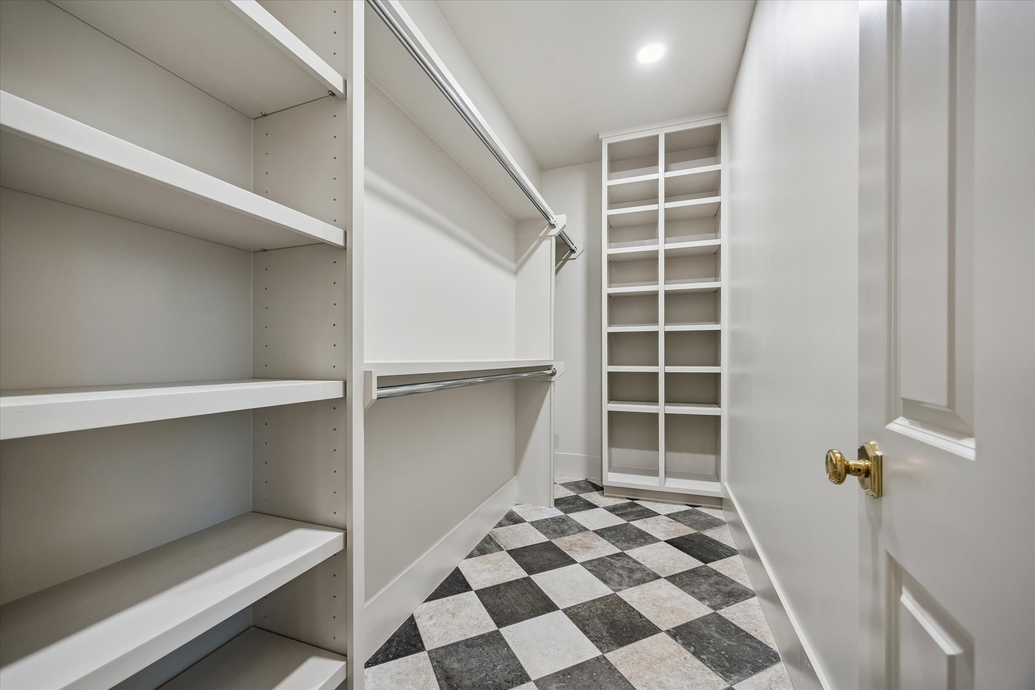 The primary closet in the addition features built-ins. This is one of TWO walk in closets for the primary bedroom.