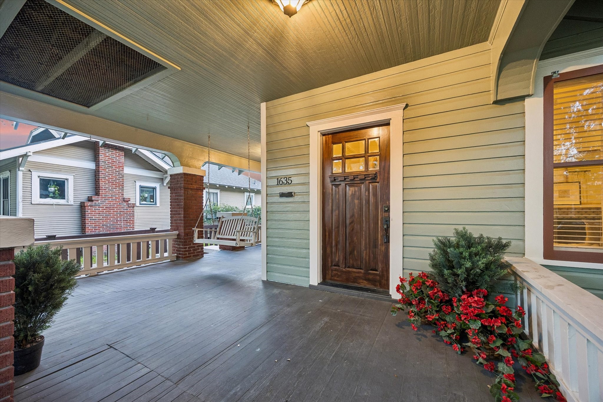 The expansive covered front porch with porch swing exudes Southern charm! The expansive covered front porch with porch swing exudes Southern charm!