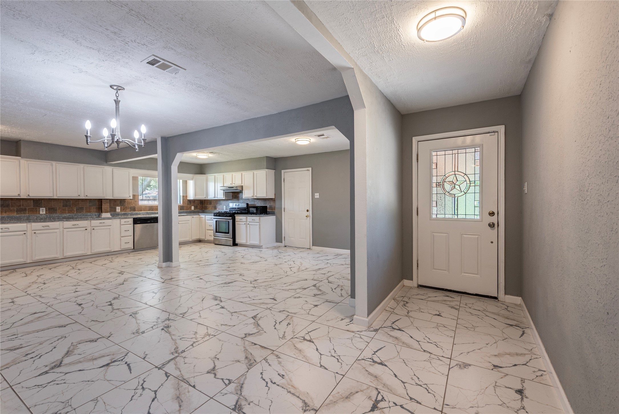 View towards front door from foyer