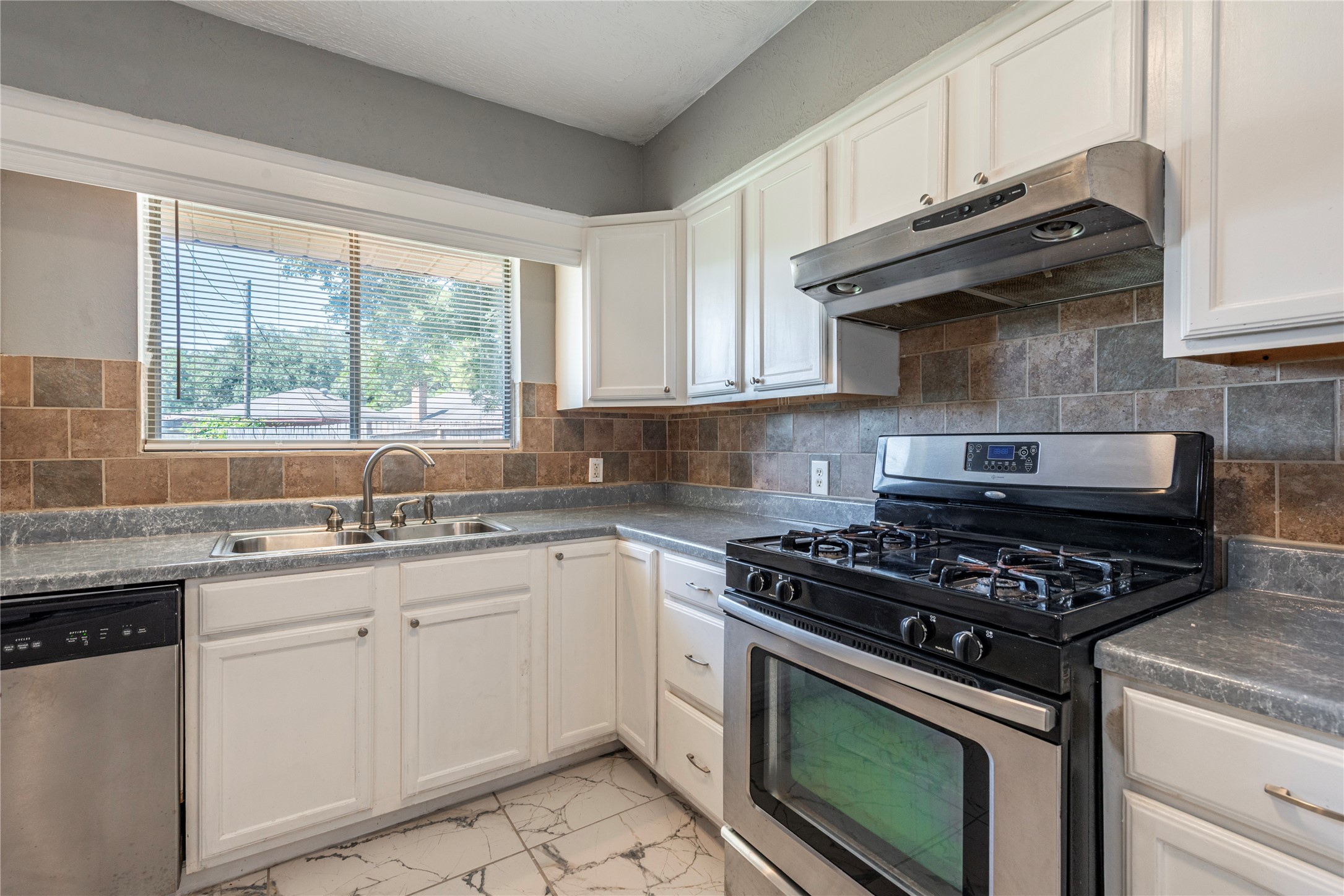 *Cabinets have been painted a dark gray.
