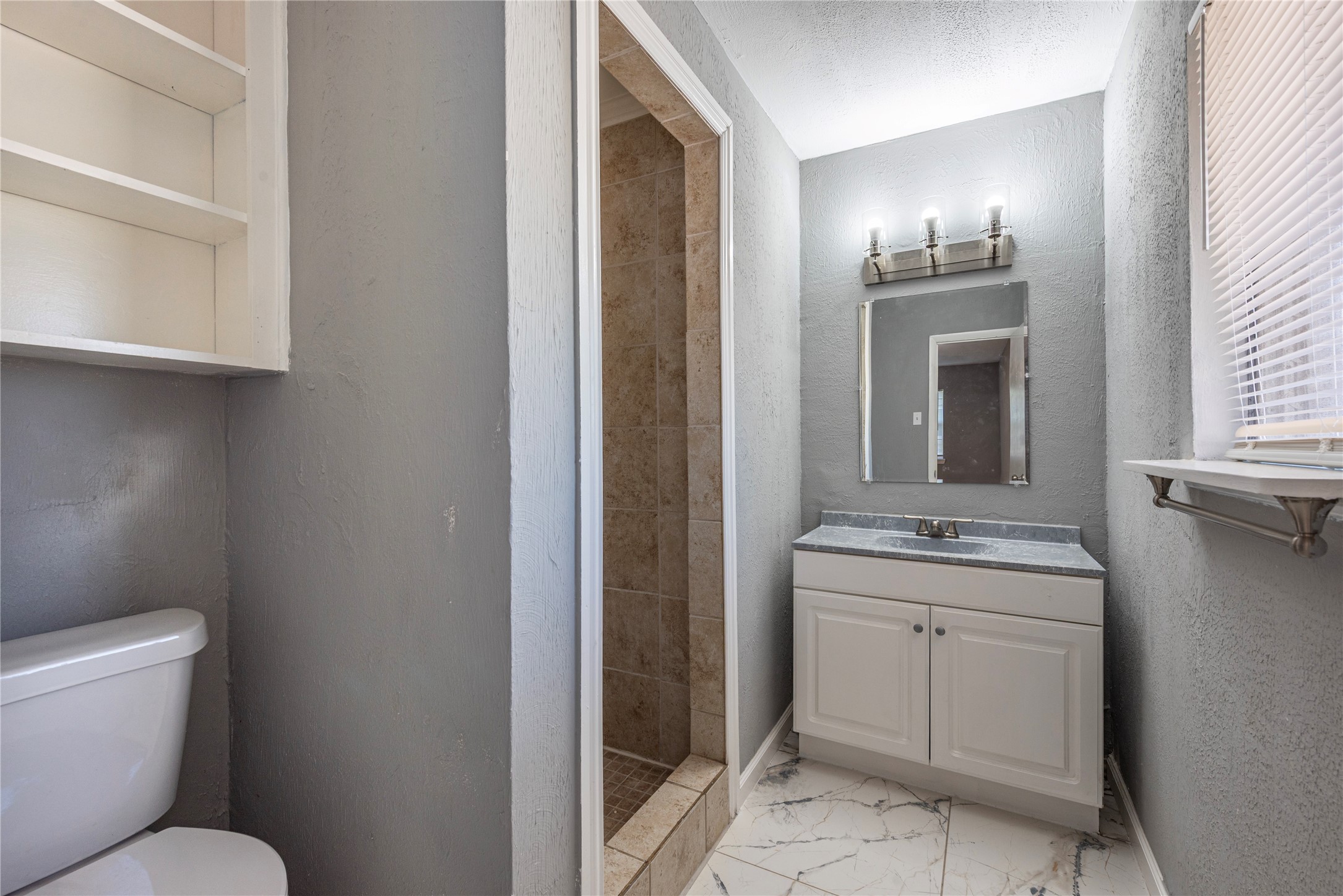 *Cabinets have been painted a dark gray. Primary bedroom
