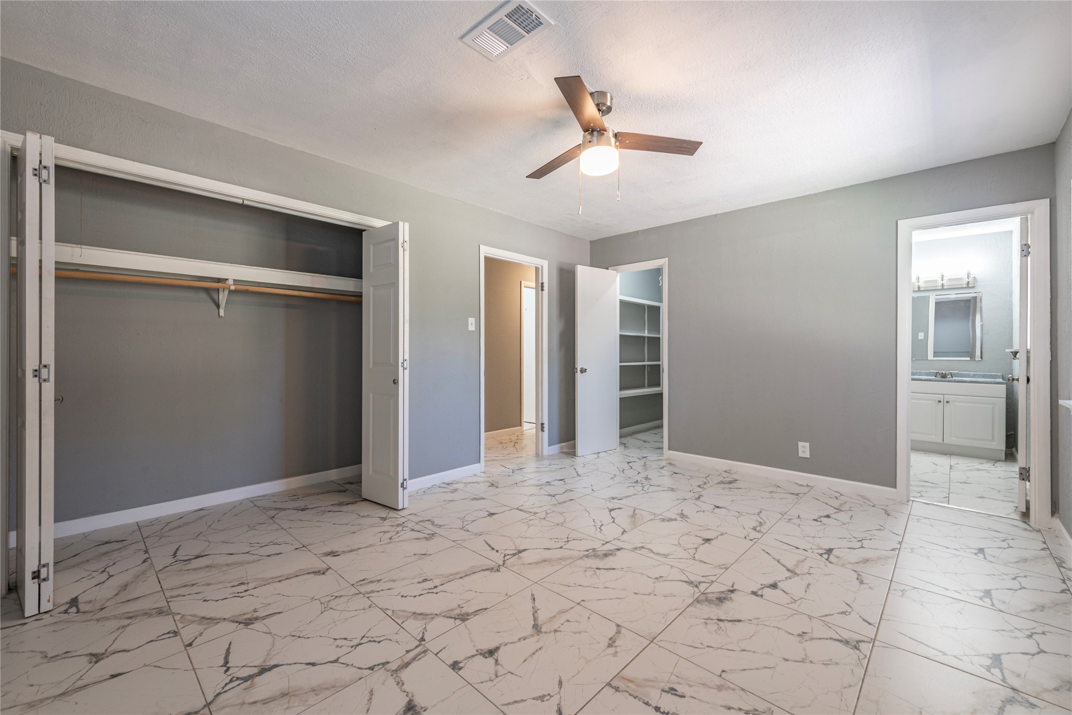 Primary bedroom has two closets and an es-suite bathroom