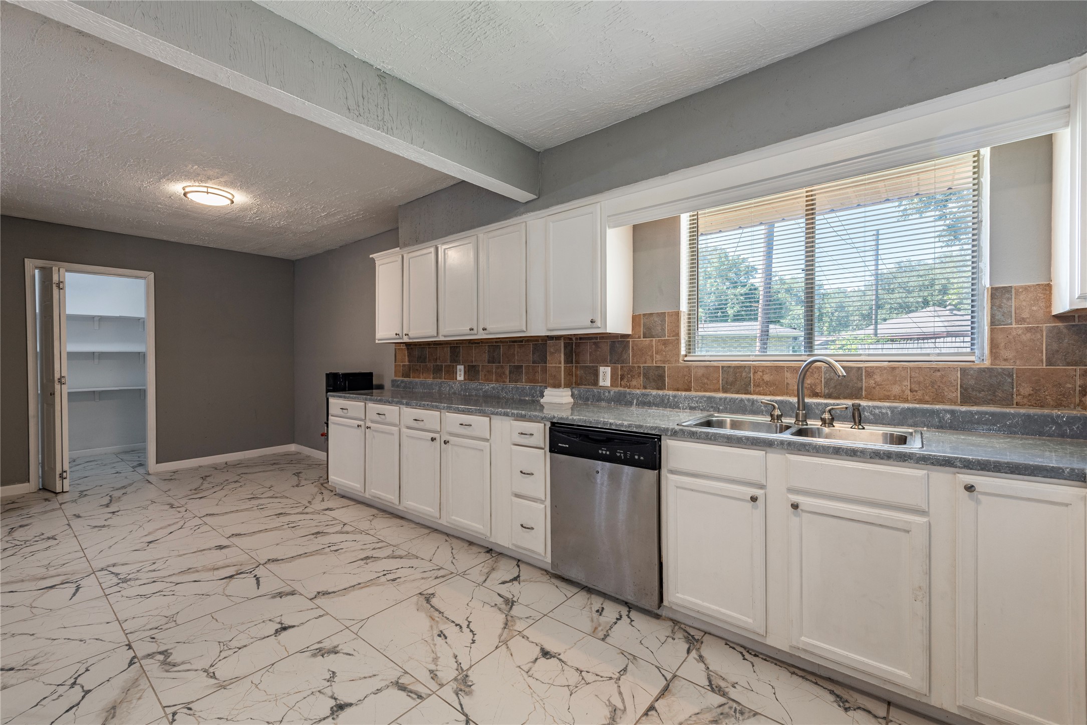 *Cabinets have been painted a dark gray.