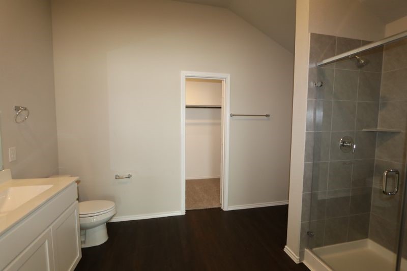 Primary bath with walk in shower and large walk-in closet Primary bath with walk in shower and large walk-in closet
