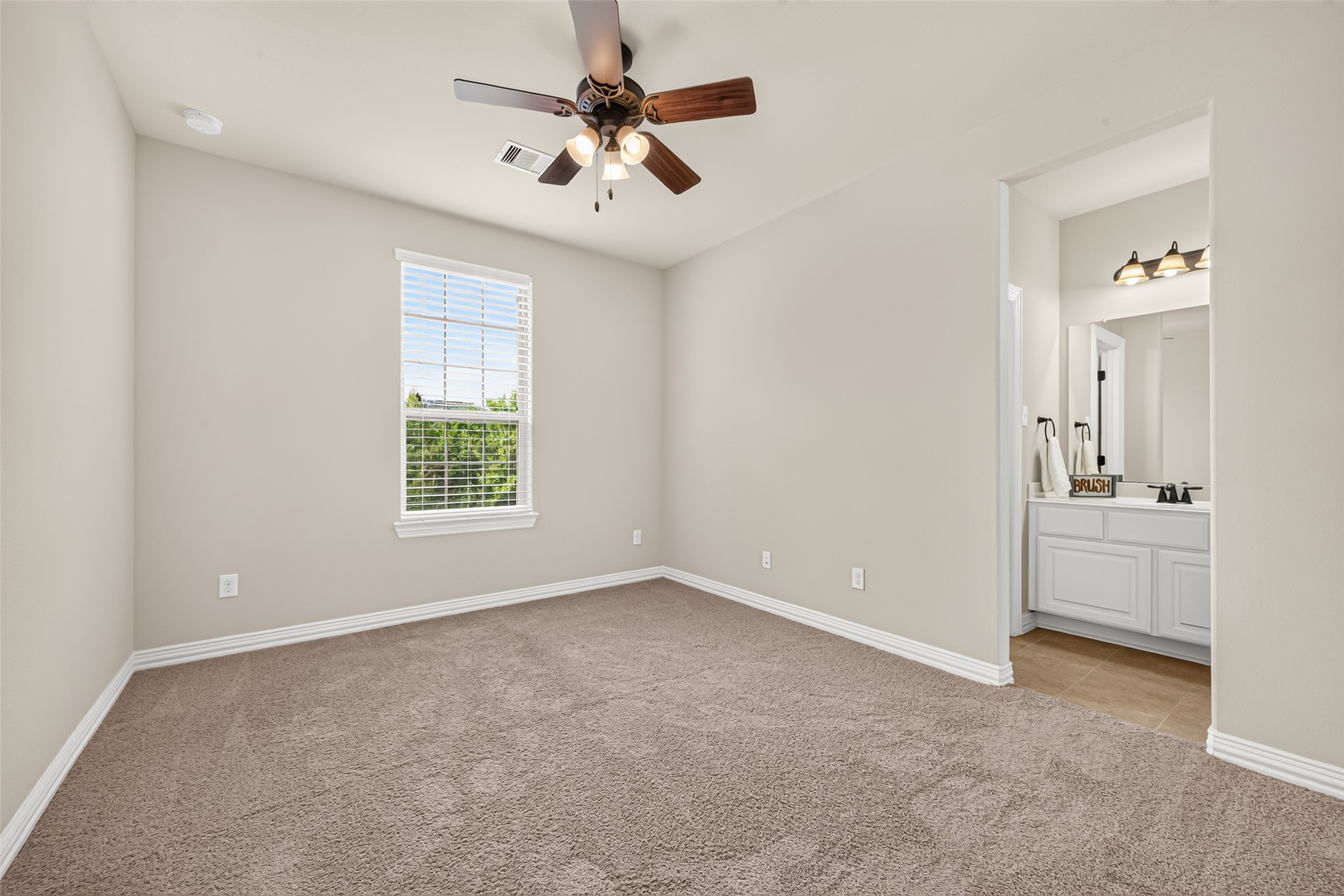 Bedroom with window and bathroom access