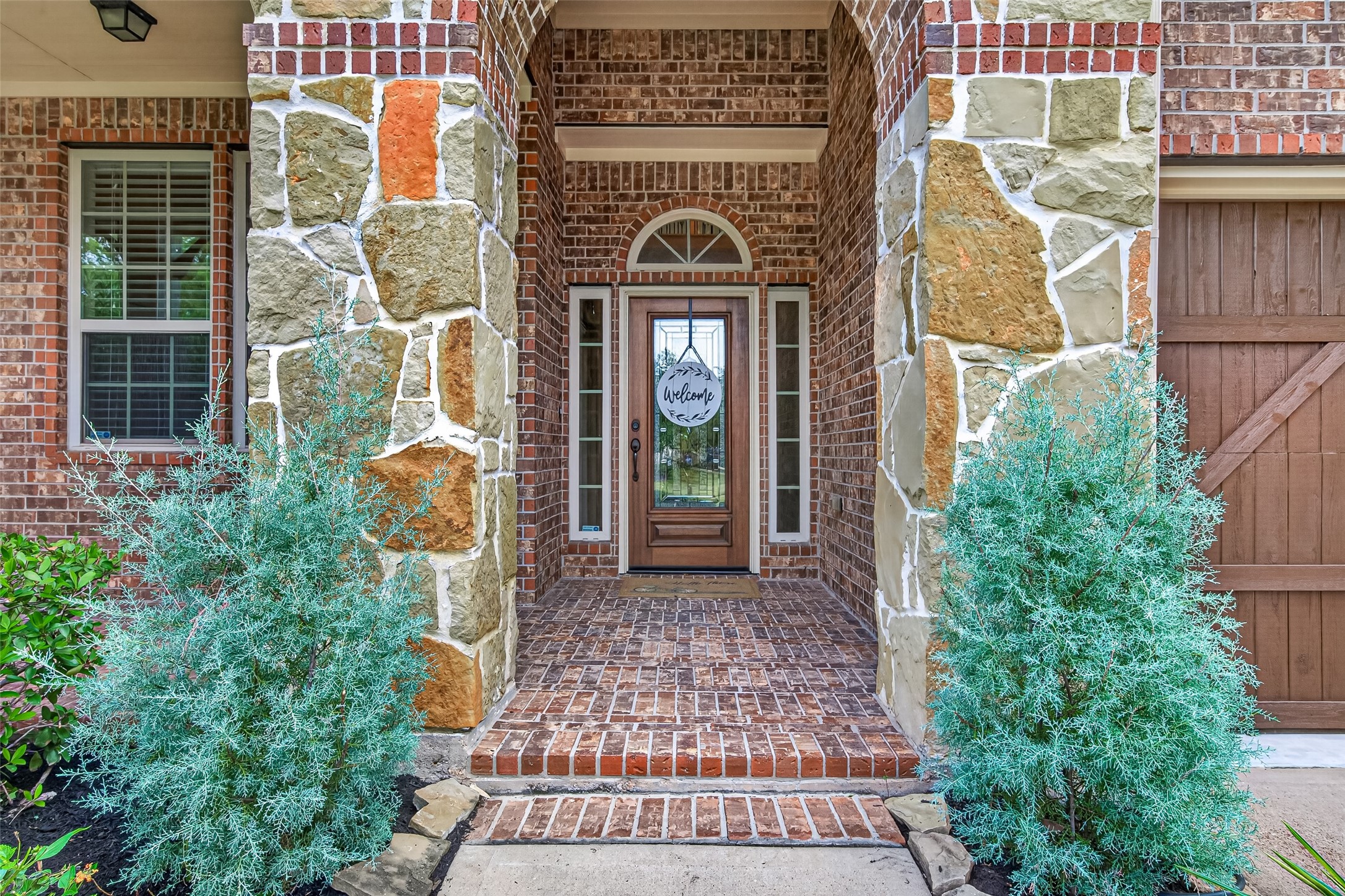 Covered front porch leading to the entry door