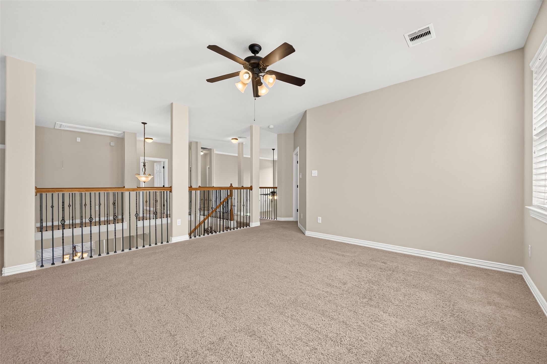 Upstairs game room with railing