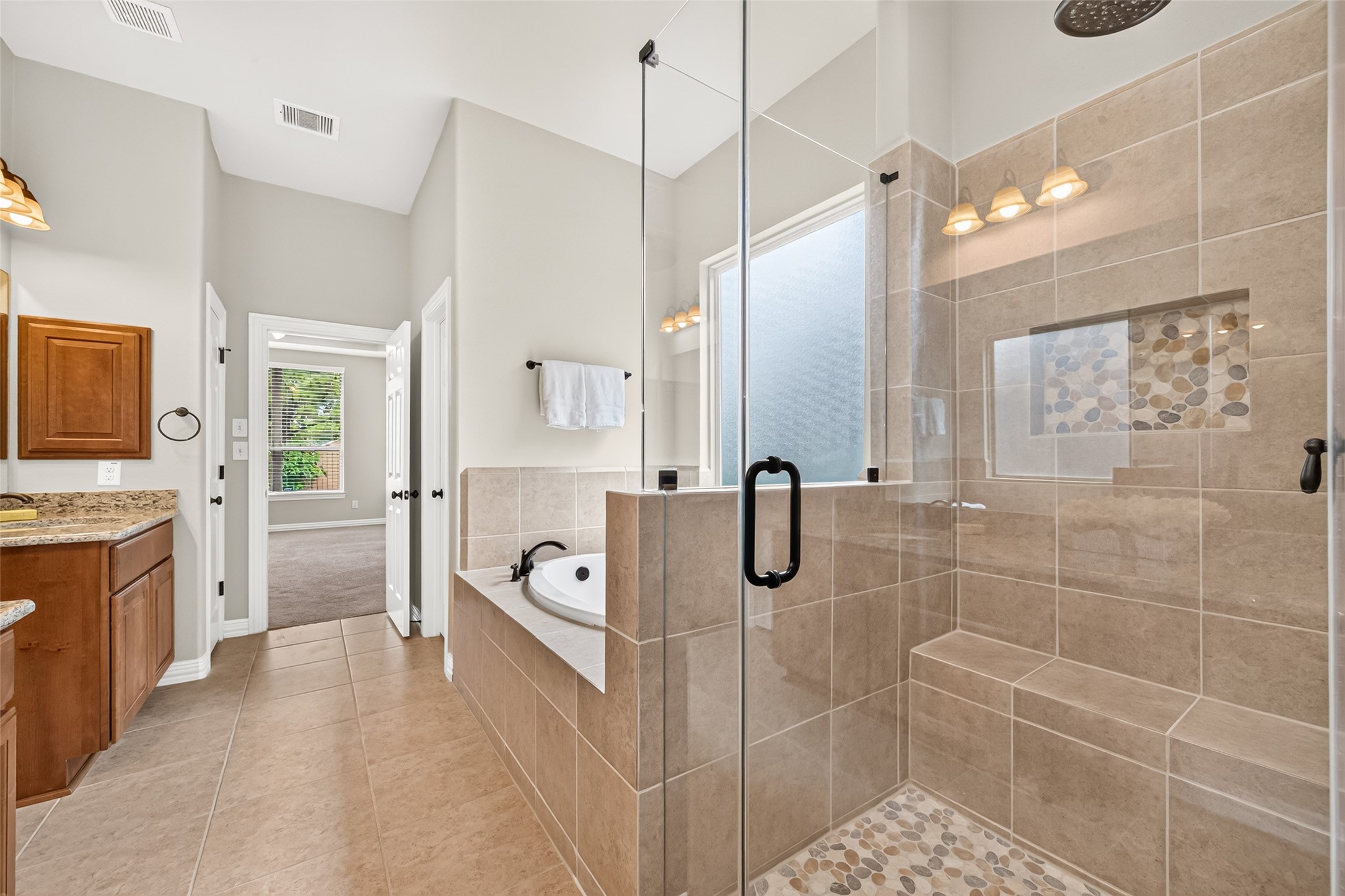 Updated primary bathroom walk-in shower