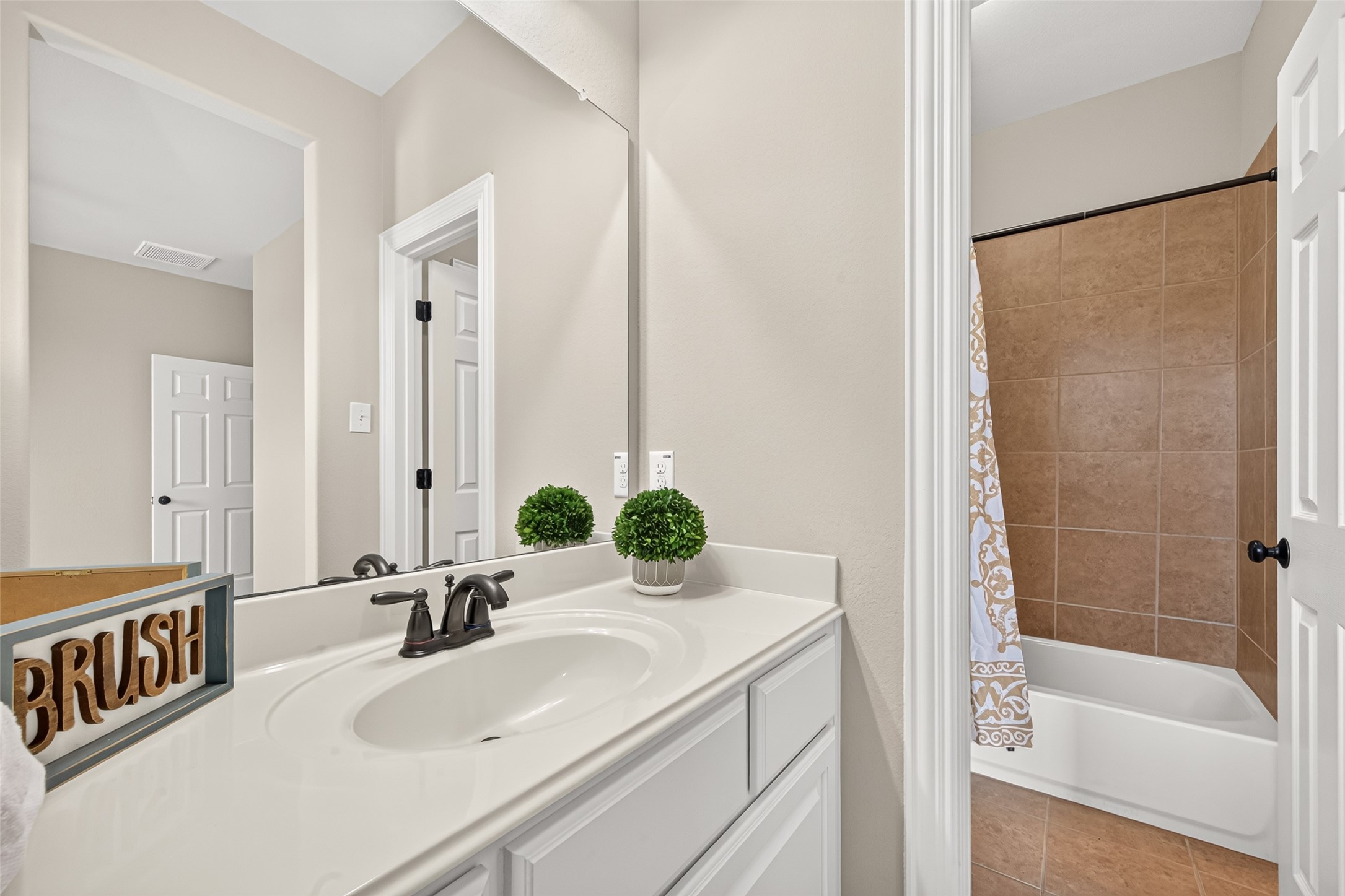 Secondary bathroom vanity and tub