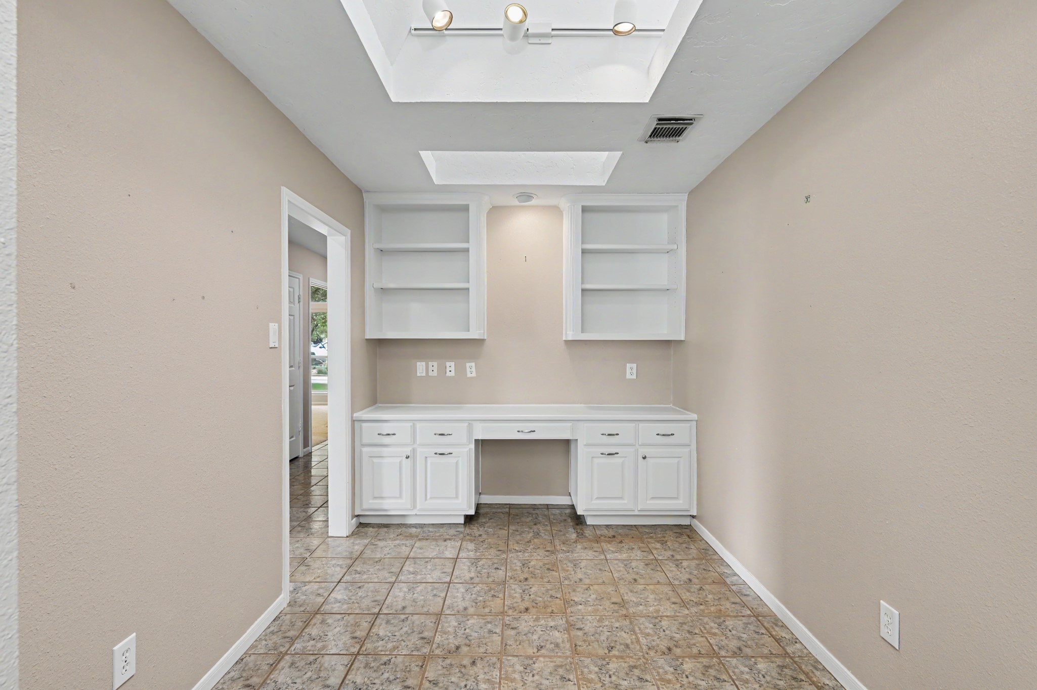 Beautiful built-in Home Office with sky lights for natural light.