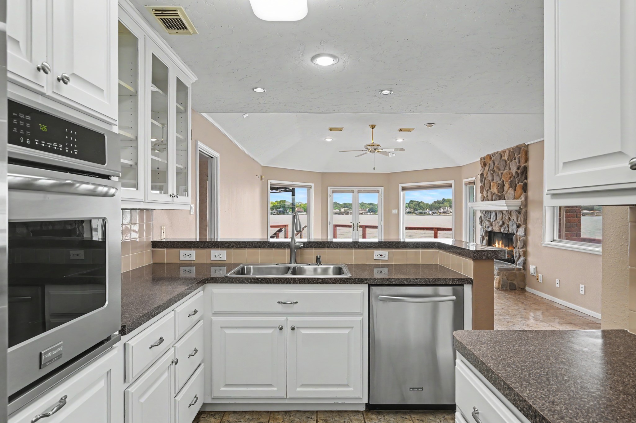 Kitchen complete with stainless steel appliances, opens to the Living & Dining Areas,
