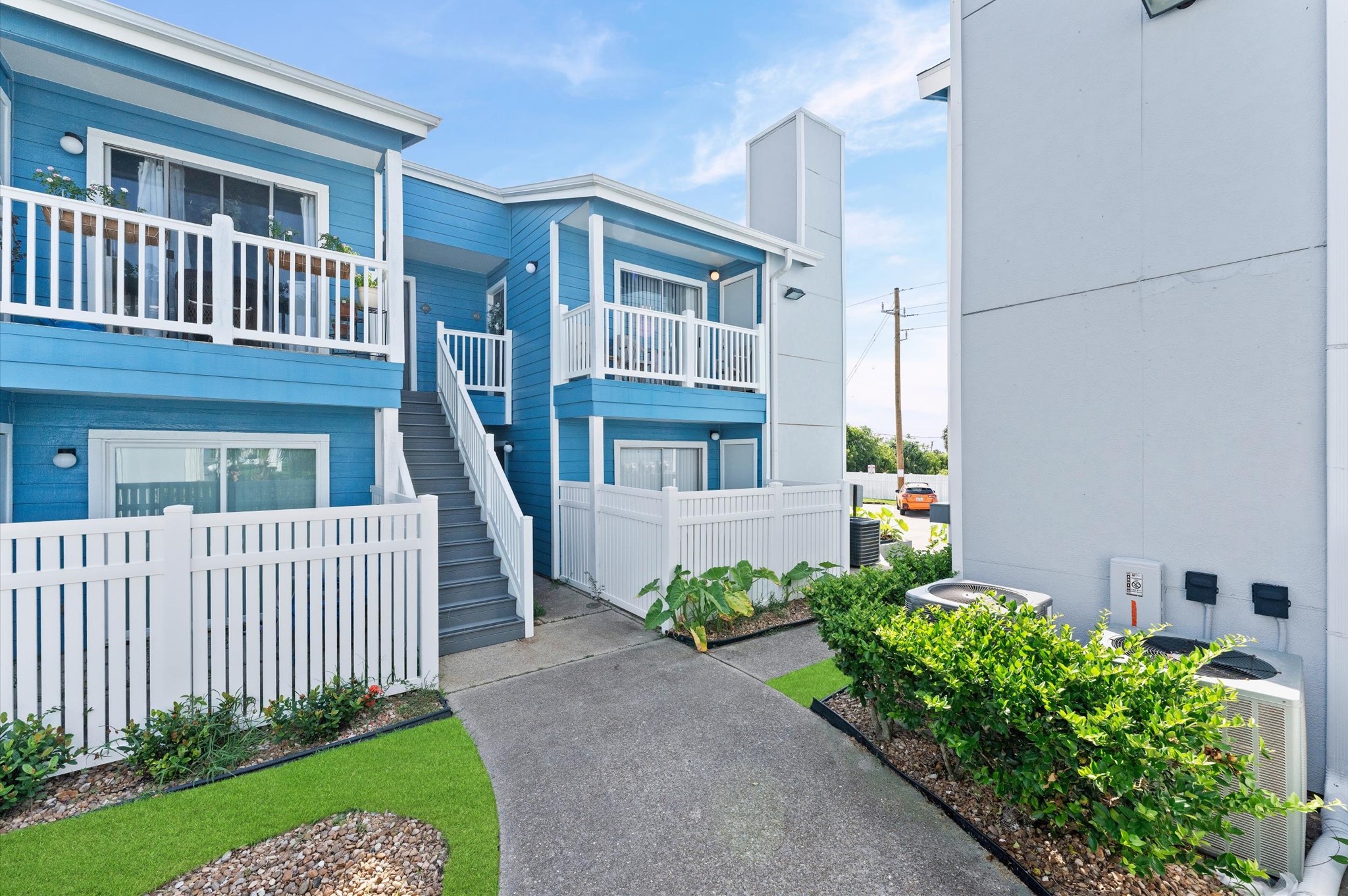 End unit with NO BACK NEIGHBORS, AND VIEWS OF THE GULF TO THE SOUTH AND MARSHLAND TO THE EAST.  Enjoy fireworks and ocean views from the back balcony off the primary bedroom, and courtyard views from the front balcony off the living room.