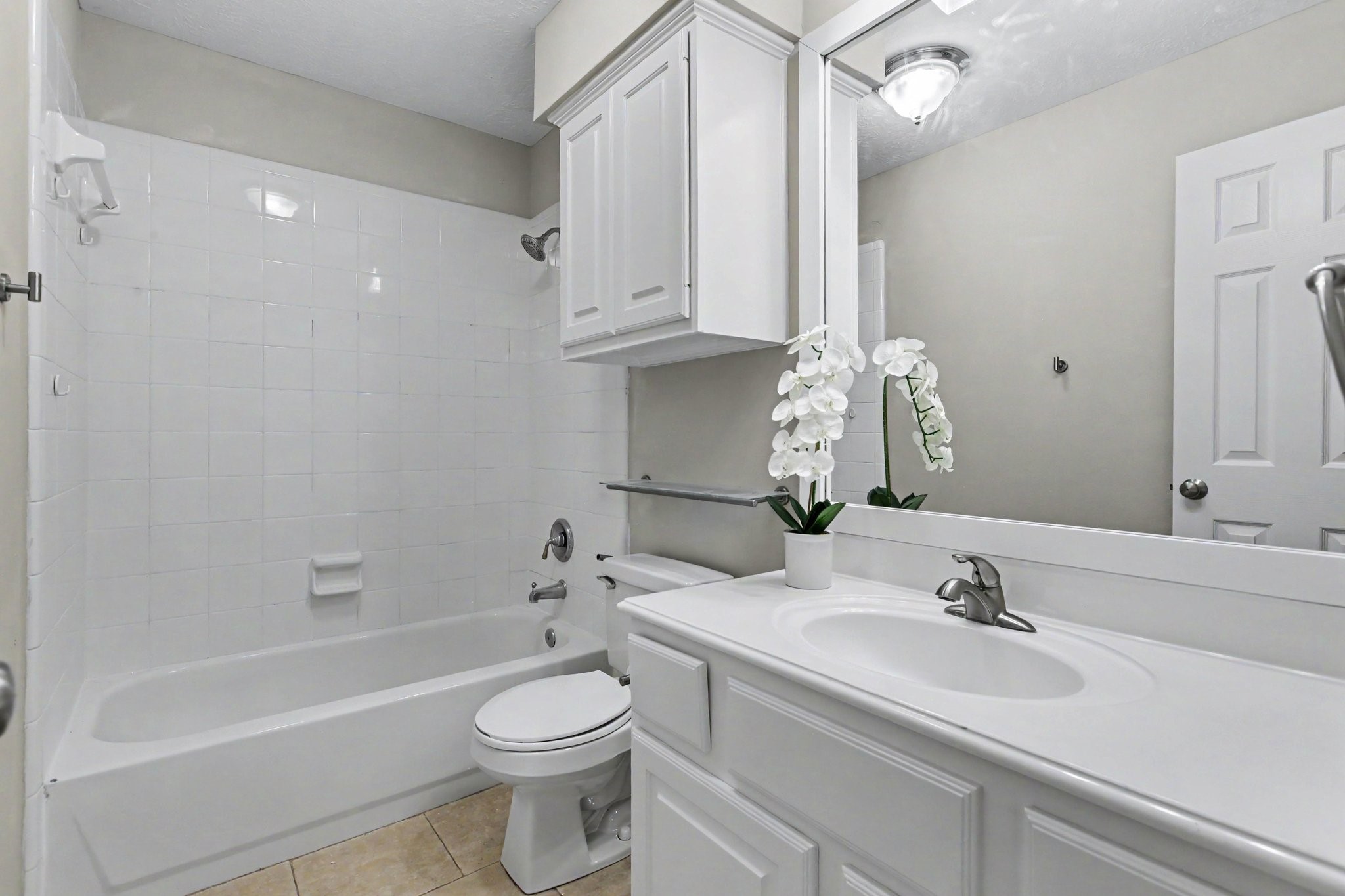 The full bathroom upstairs is complete with tub and shower combo, a full size vanity, and lots of storage space.
