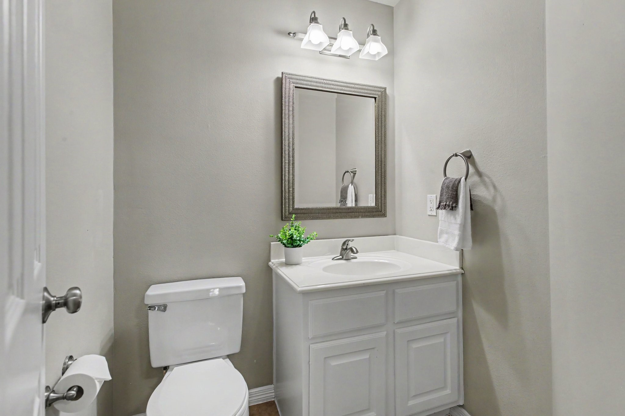 This powder bath downstairs is perfectly positioned for guests near the main living room areas of the home.