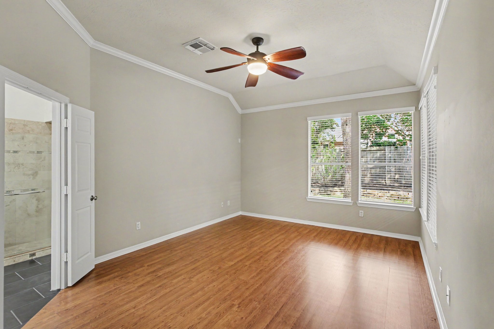 An additional view of the Owner's Suite with double doors which encompasses an ensuite bathroom and walk-in closet.