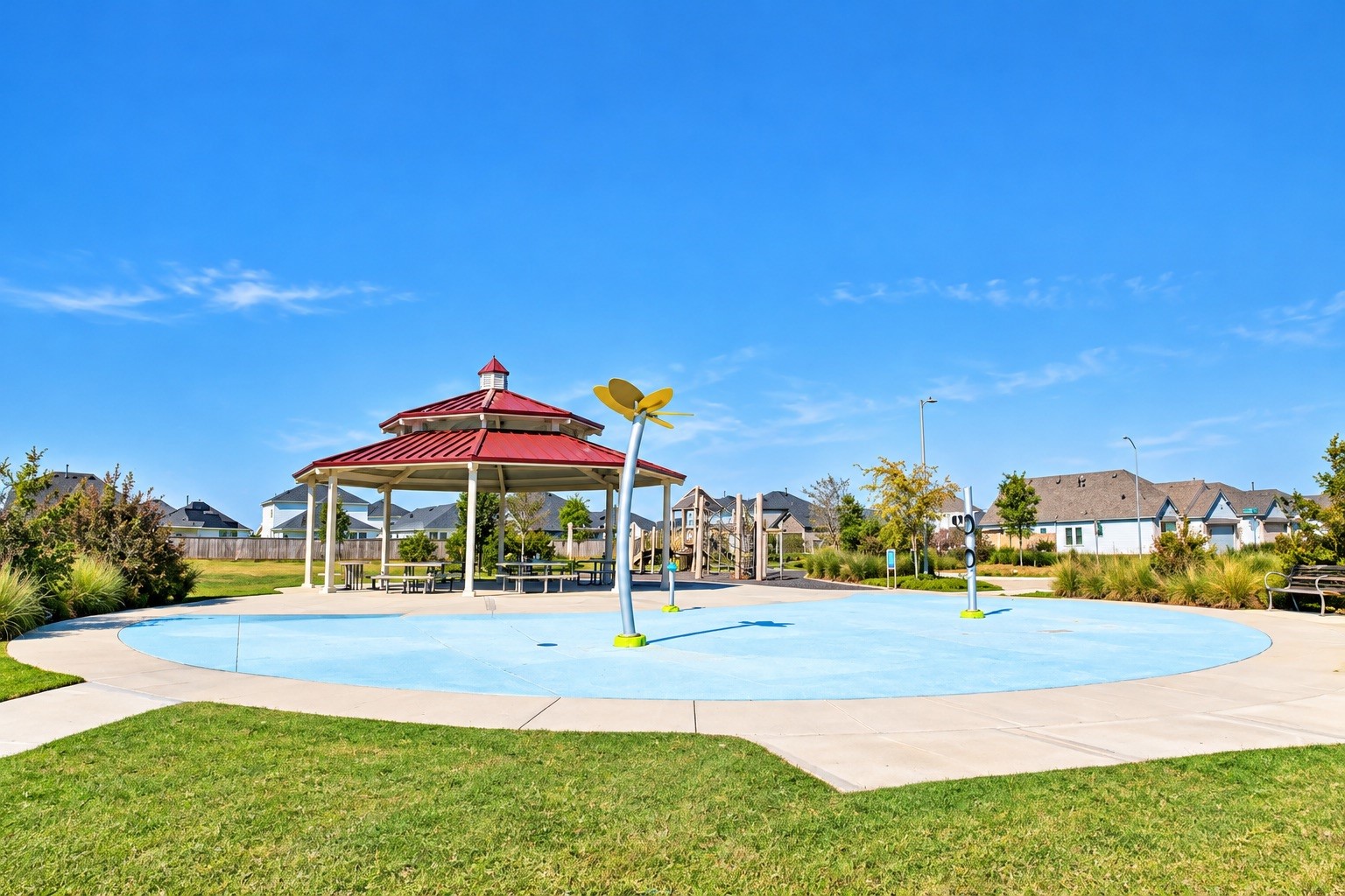 Community park offering a spacious gazebo and a fun splash pad, perfect for family gatherings and outdoor enjoyment.