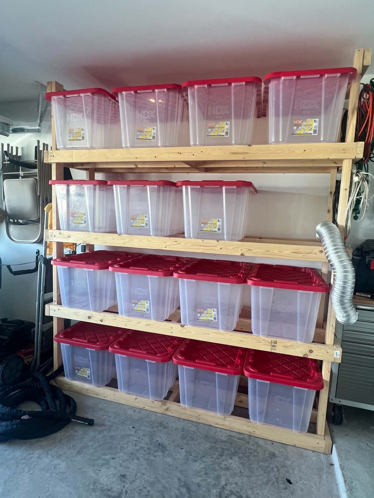 Secured shelving in garage. Storage bins not included